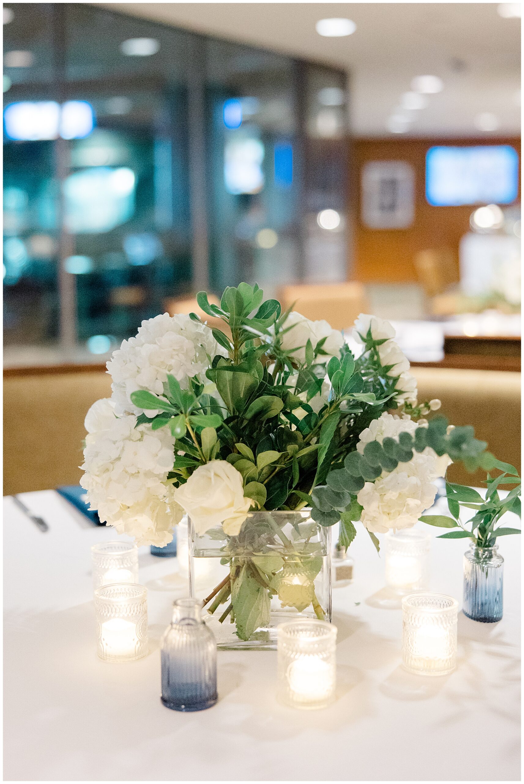 classic white flower centerpieces from Fenway Park Rehearsal Dinner