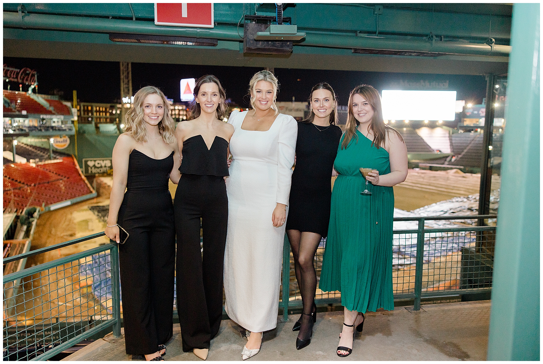 bride with friends at Fenway Park Rehearsal Dinner