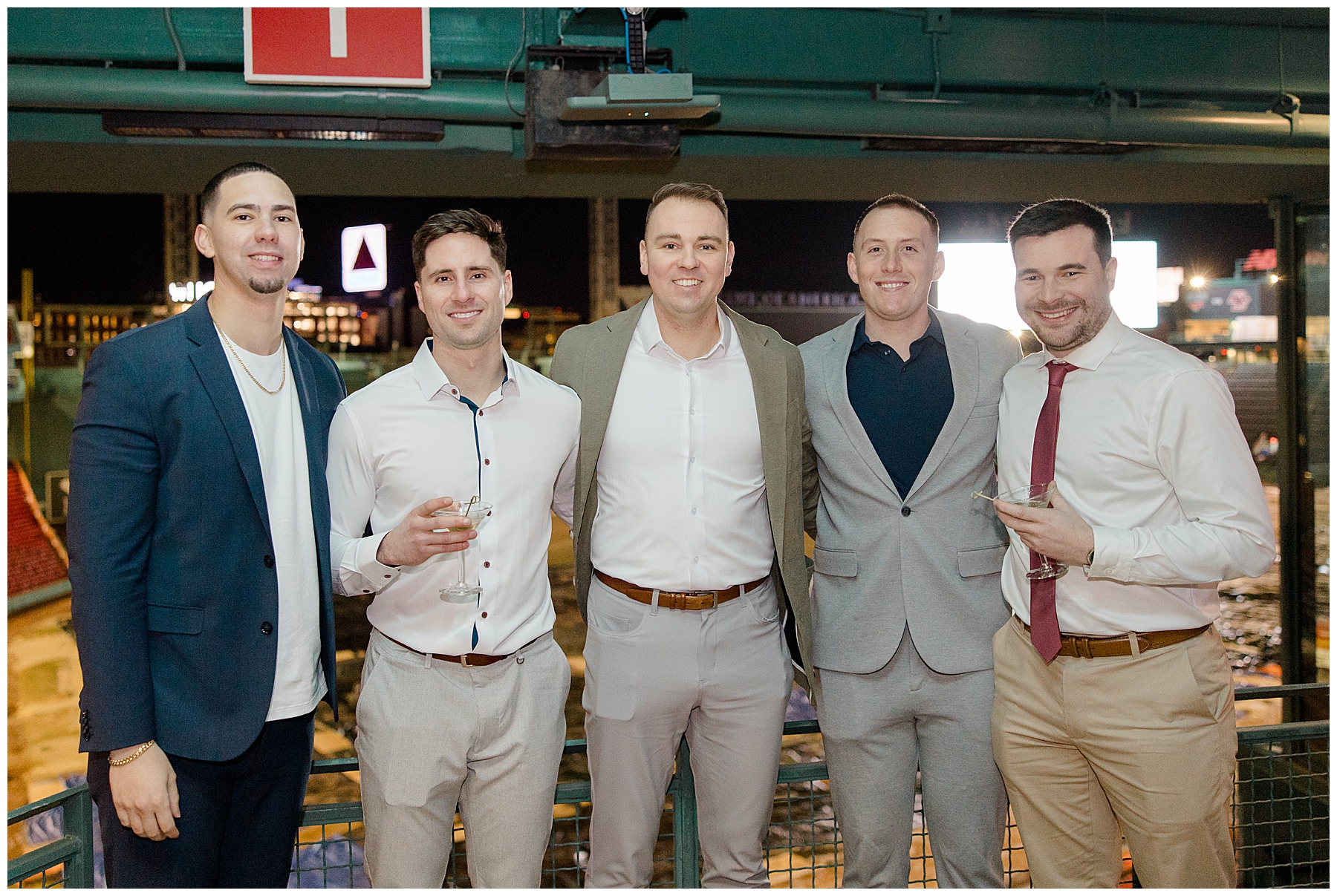 groom with friends at Fenway Park Rehearsal Dinner