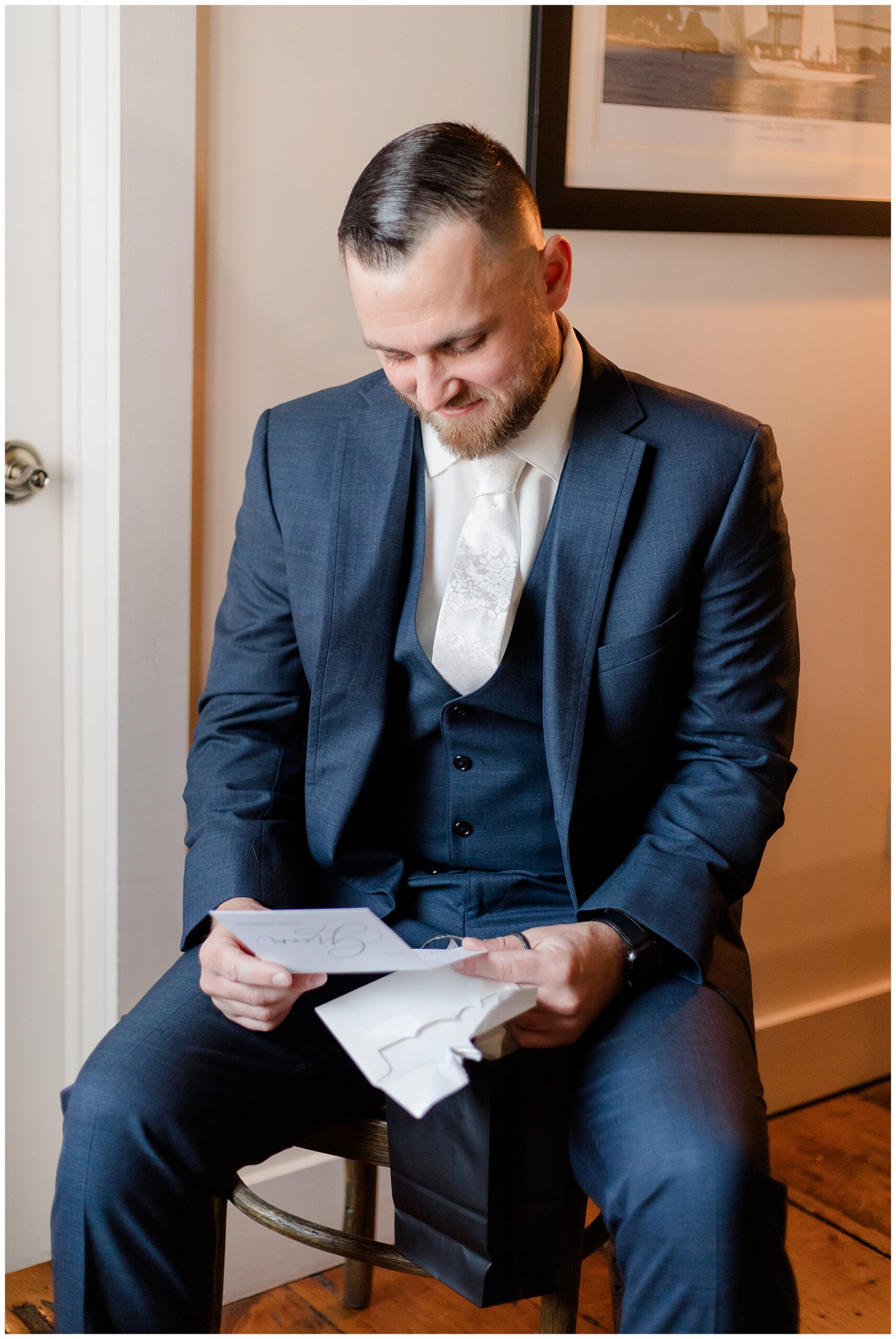 groom reading card from bride