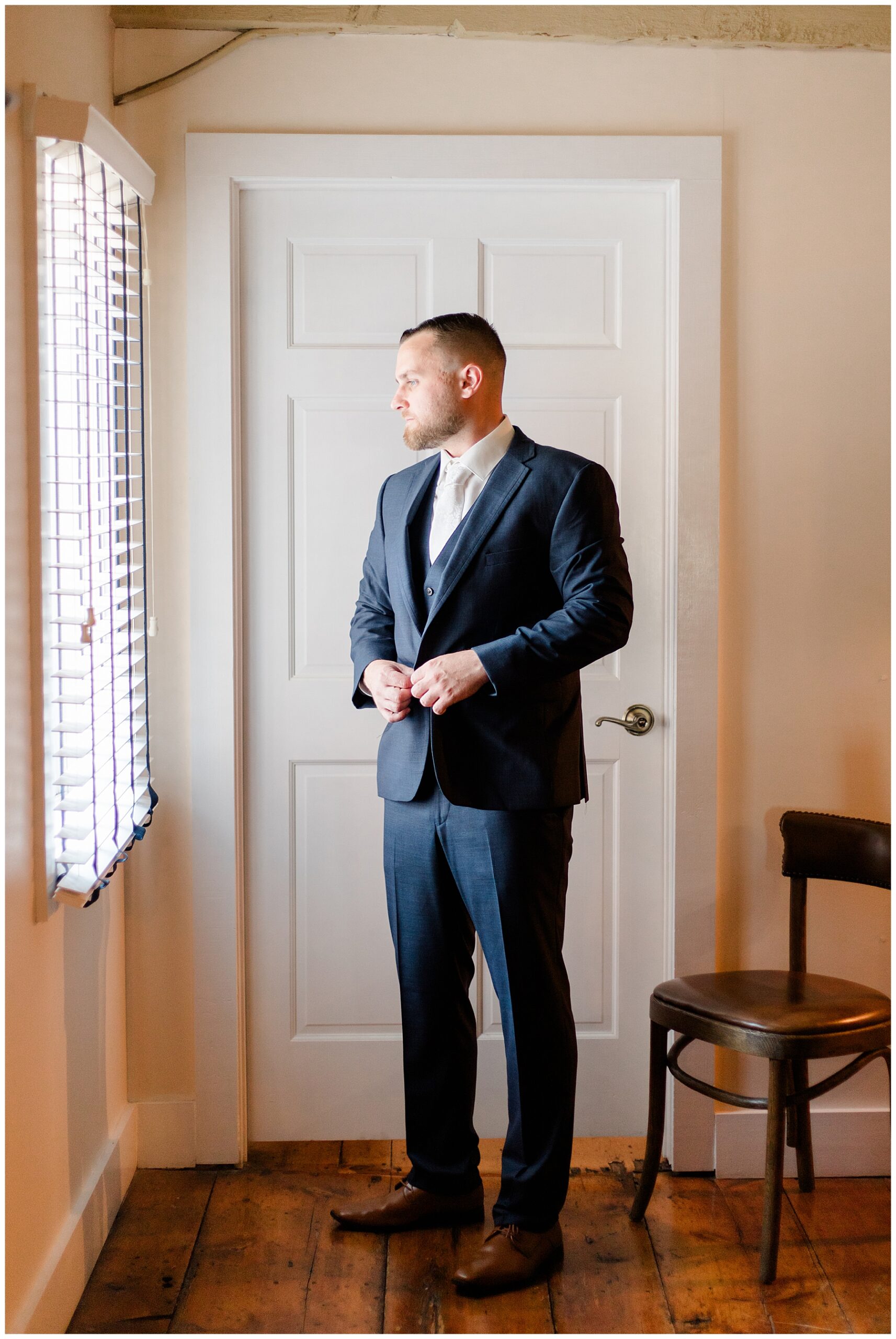 groom getting ready for Bristol Harbor Inn Coastal Wedding