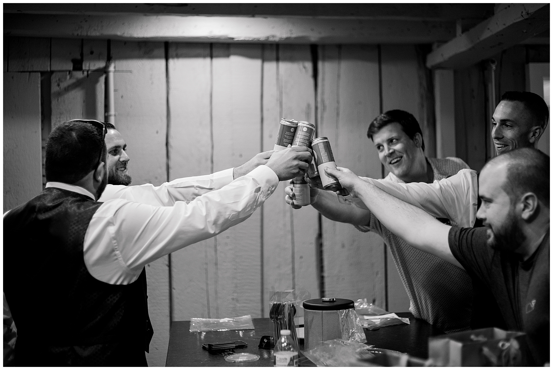 groom and groomsmen cheers before Bristol Harbor Inn Coastal Wedding