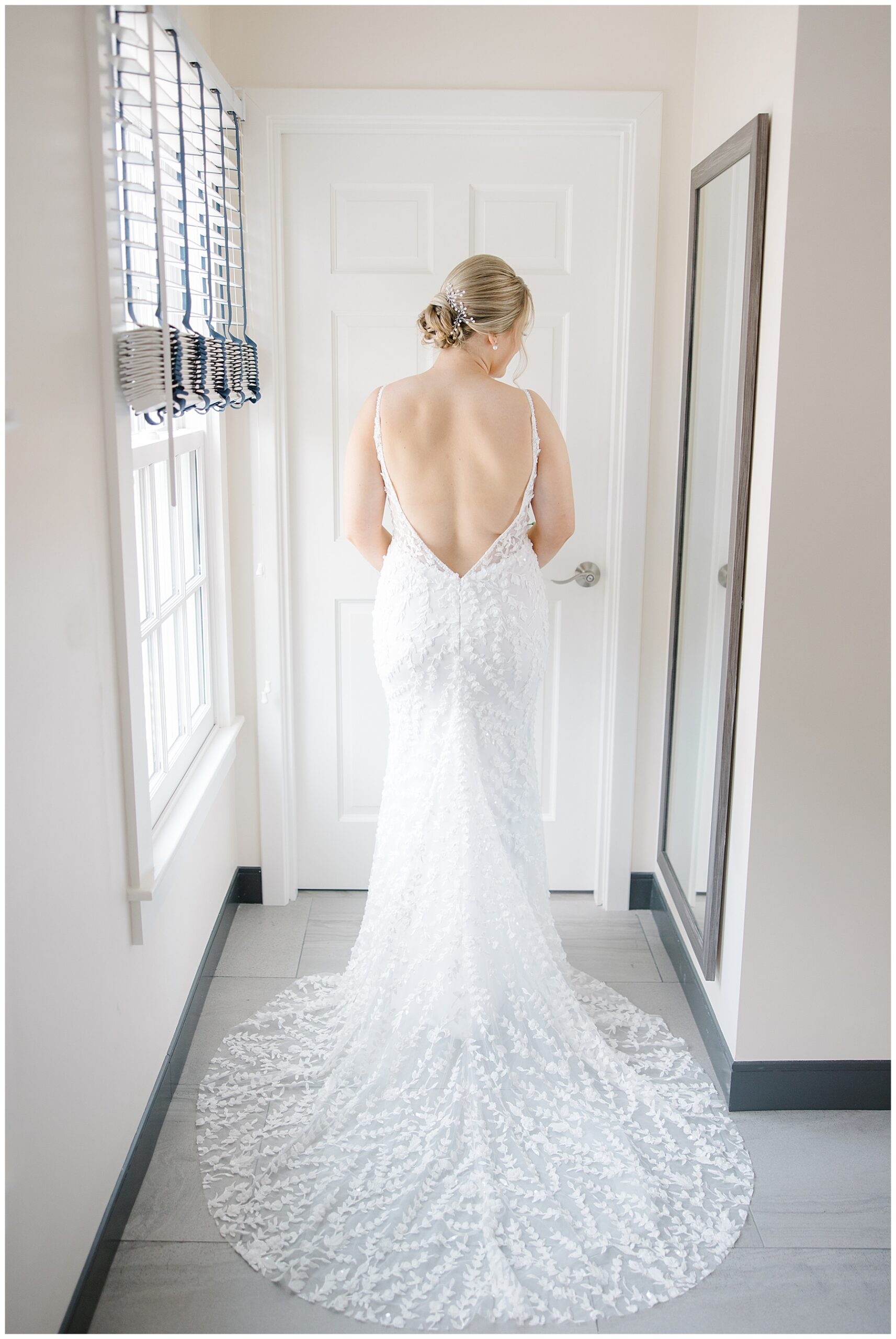 back of brides gorgeous wedding dress with lace detail