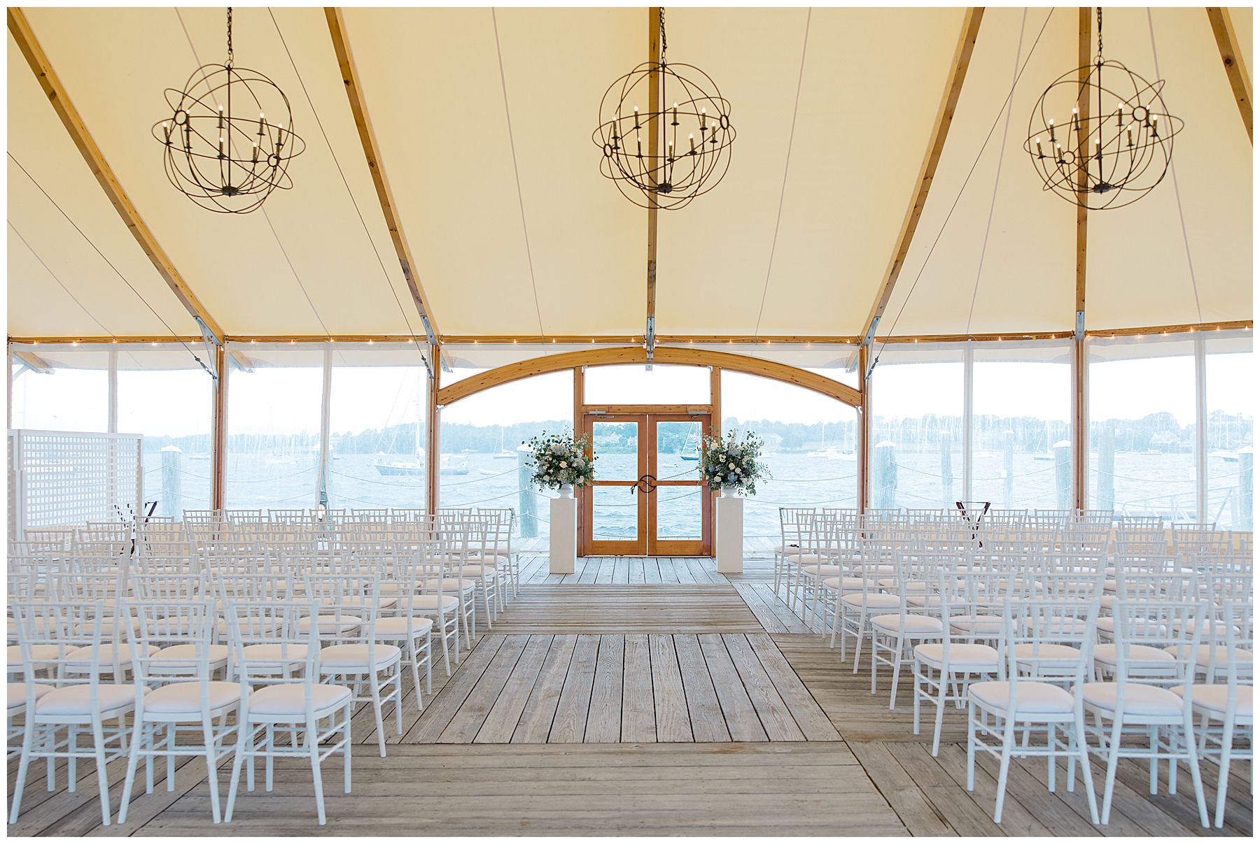 elegant wedding ceremony under tent at Bristol Harbor Inn Coastal Wedding