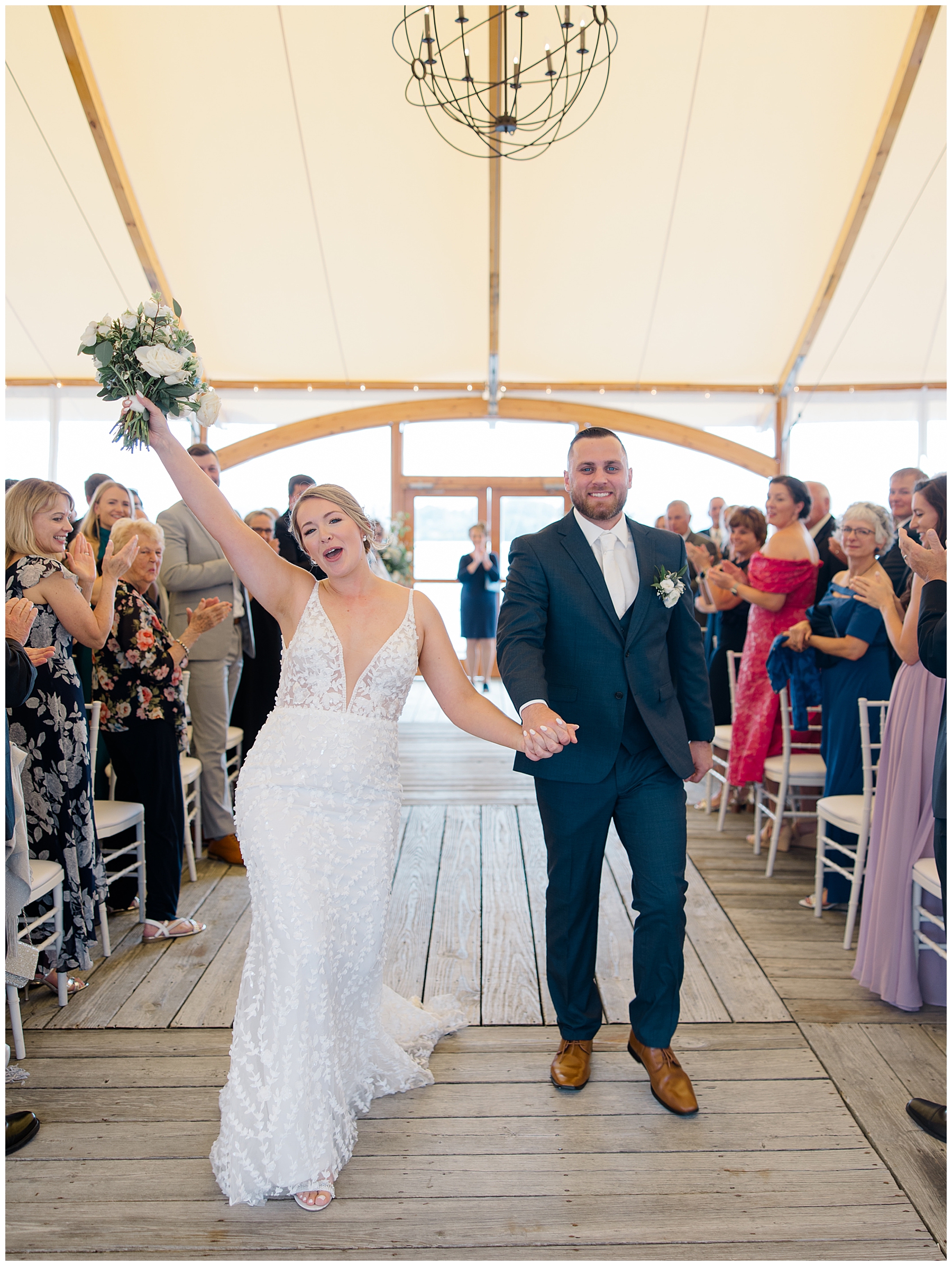 bride and groom celebrate and cheer as they exit wedding ceremony