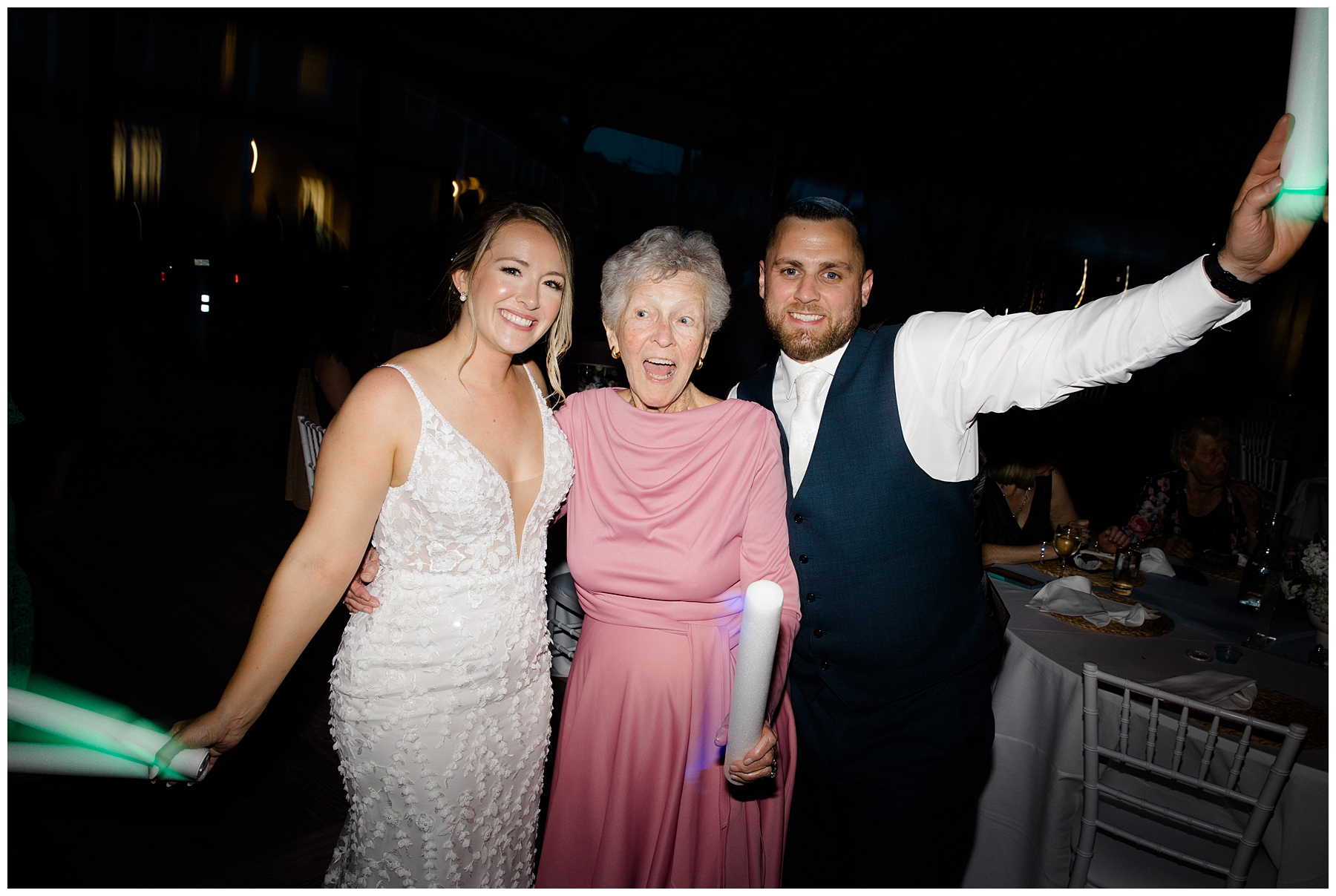 bride and groom with guest during Bristol Harbor Inn Coastal Wedding