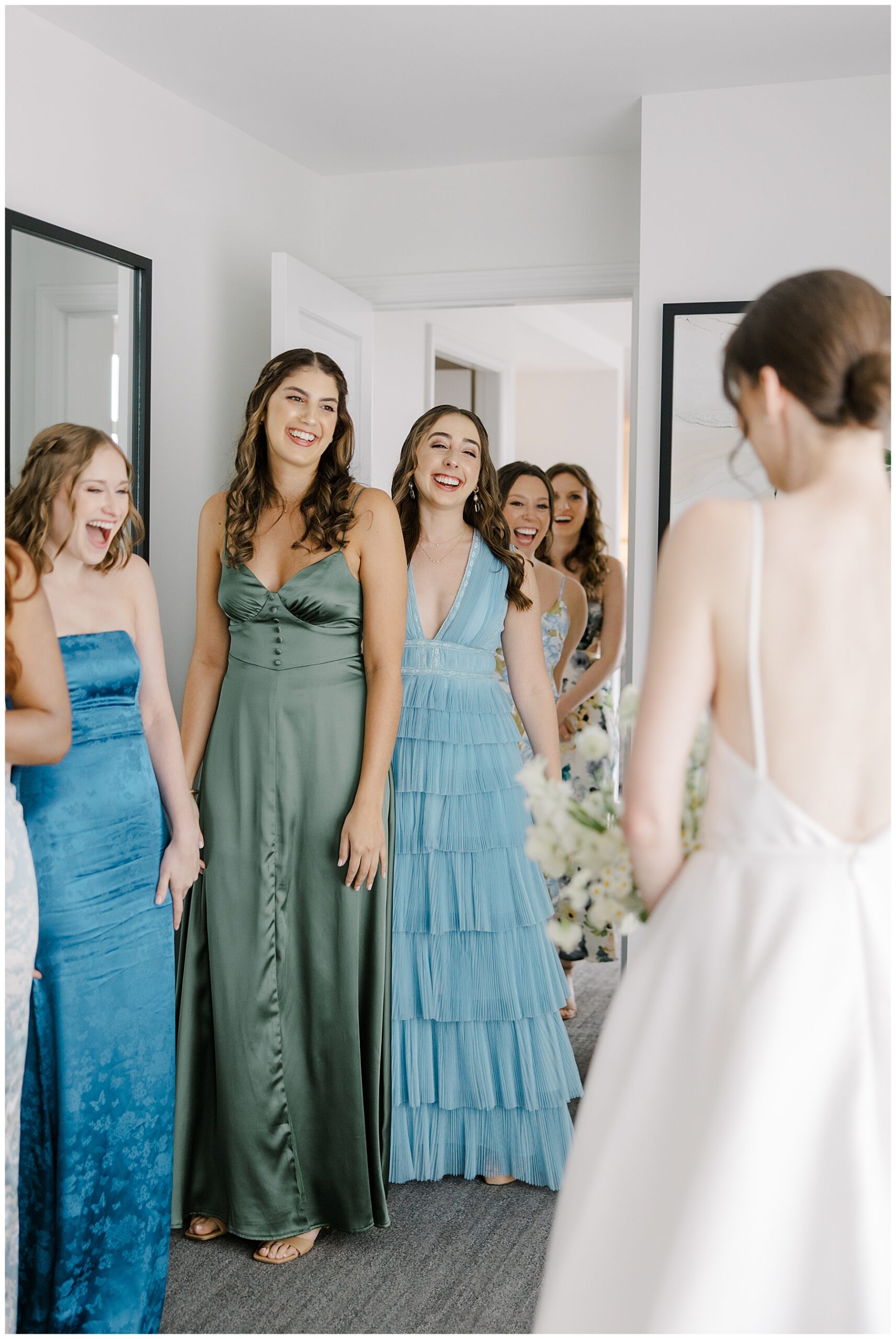 bride's first look with bridesmaids