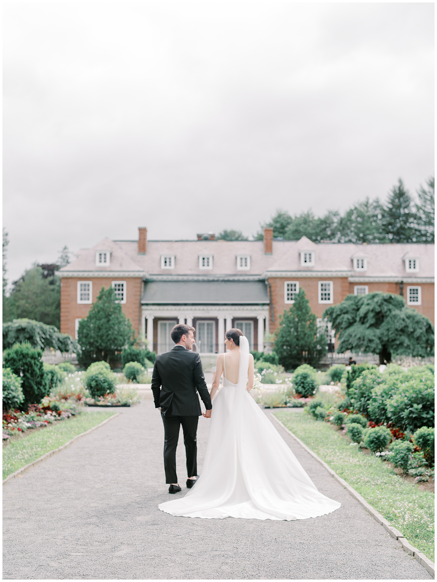 couple walk together holding hands 