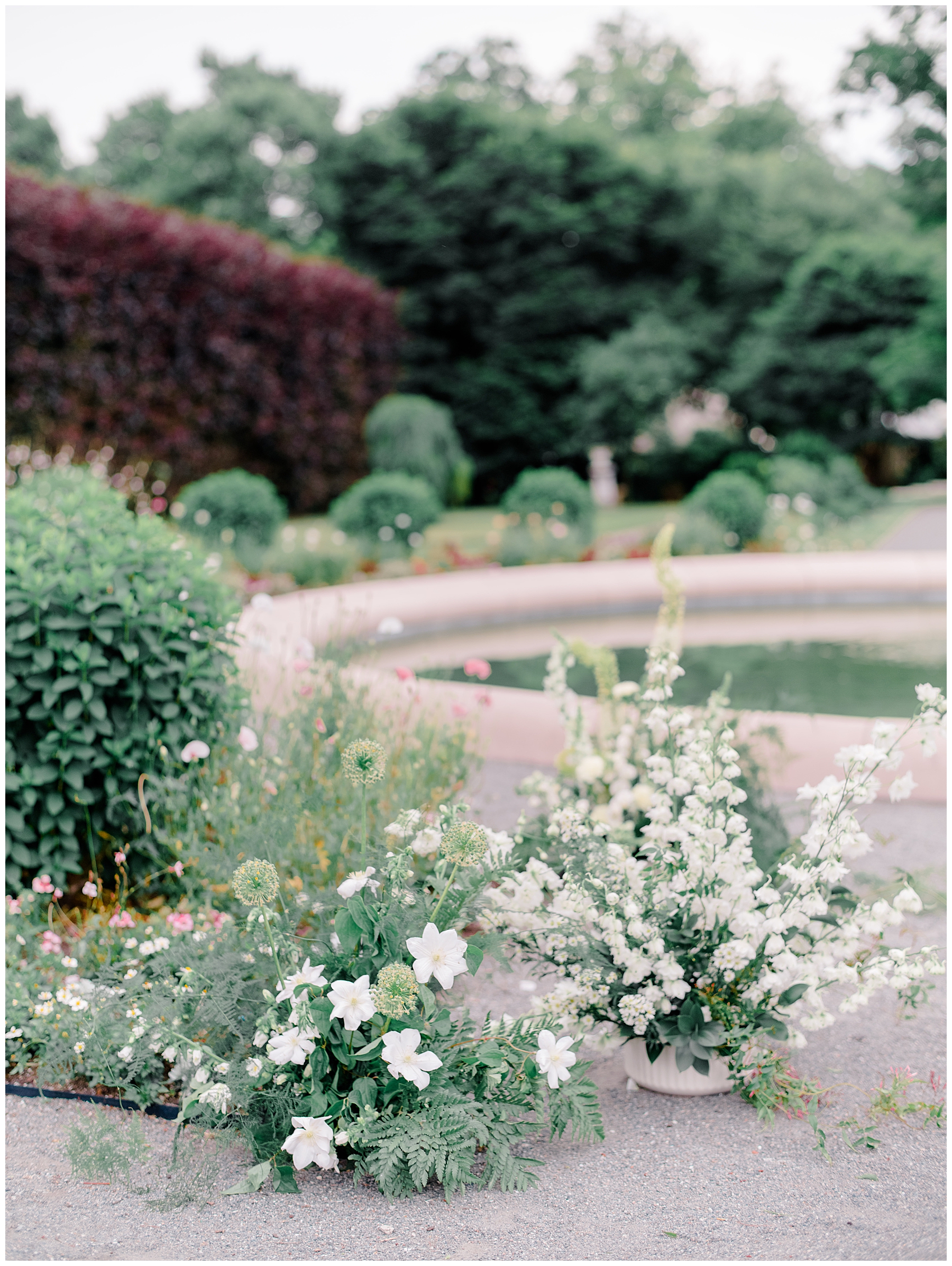 garden flowers surround fountain