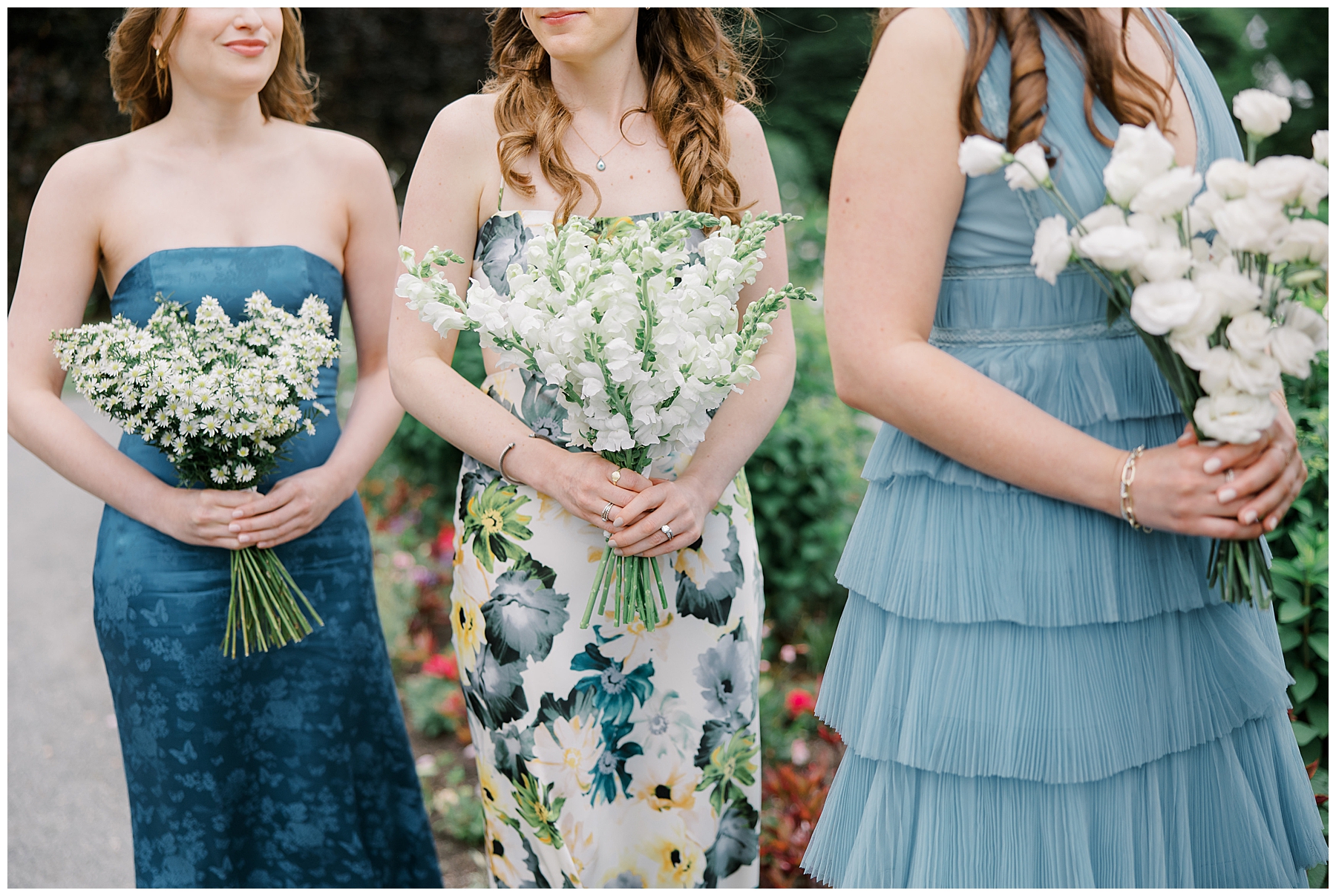 bridesmaids dresses and white flower bouquets