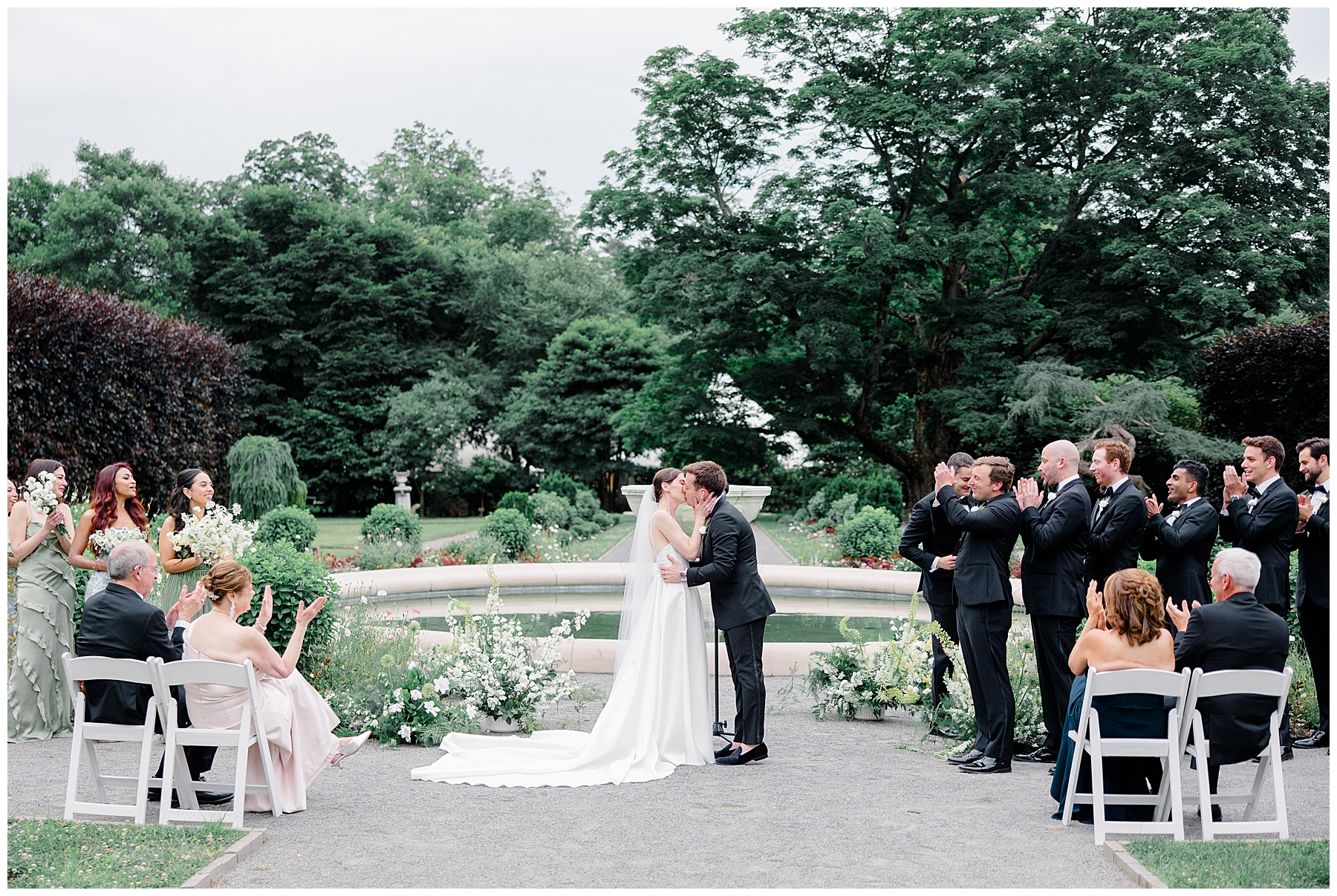 bride and groom kiss at wedding ceremony 