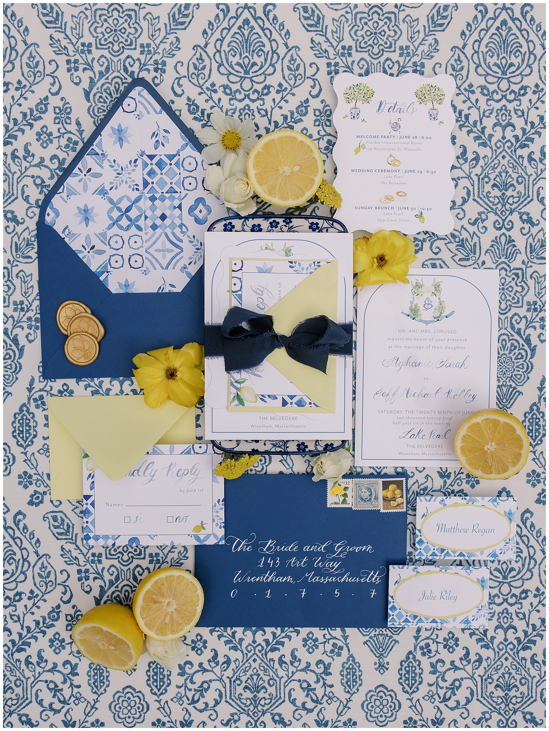 fresh flat lay design featuring blue and white invitation suite and fresh lemons