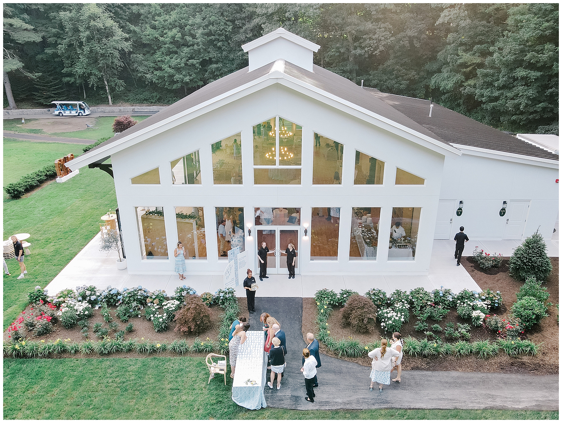 guests mingle outside of  The Belvedere at Lake Pearl Wrentham