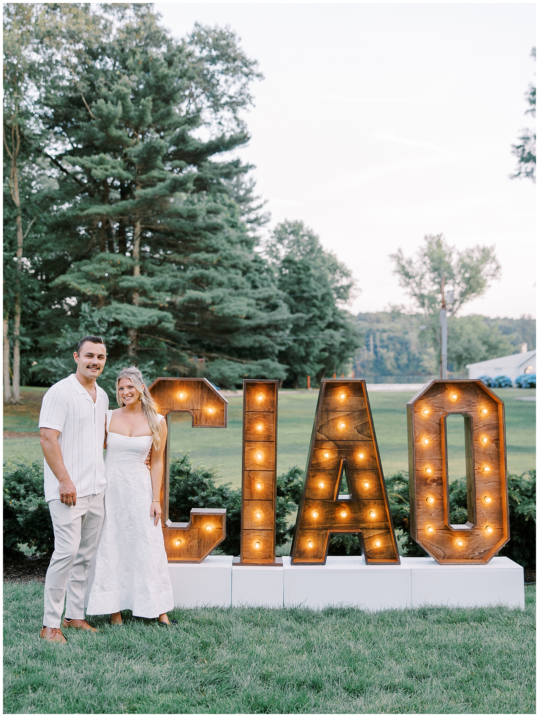 couple by CIAO sign at Grand Opening event