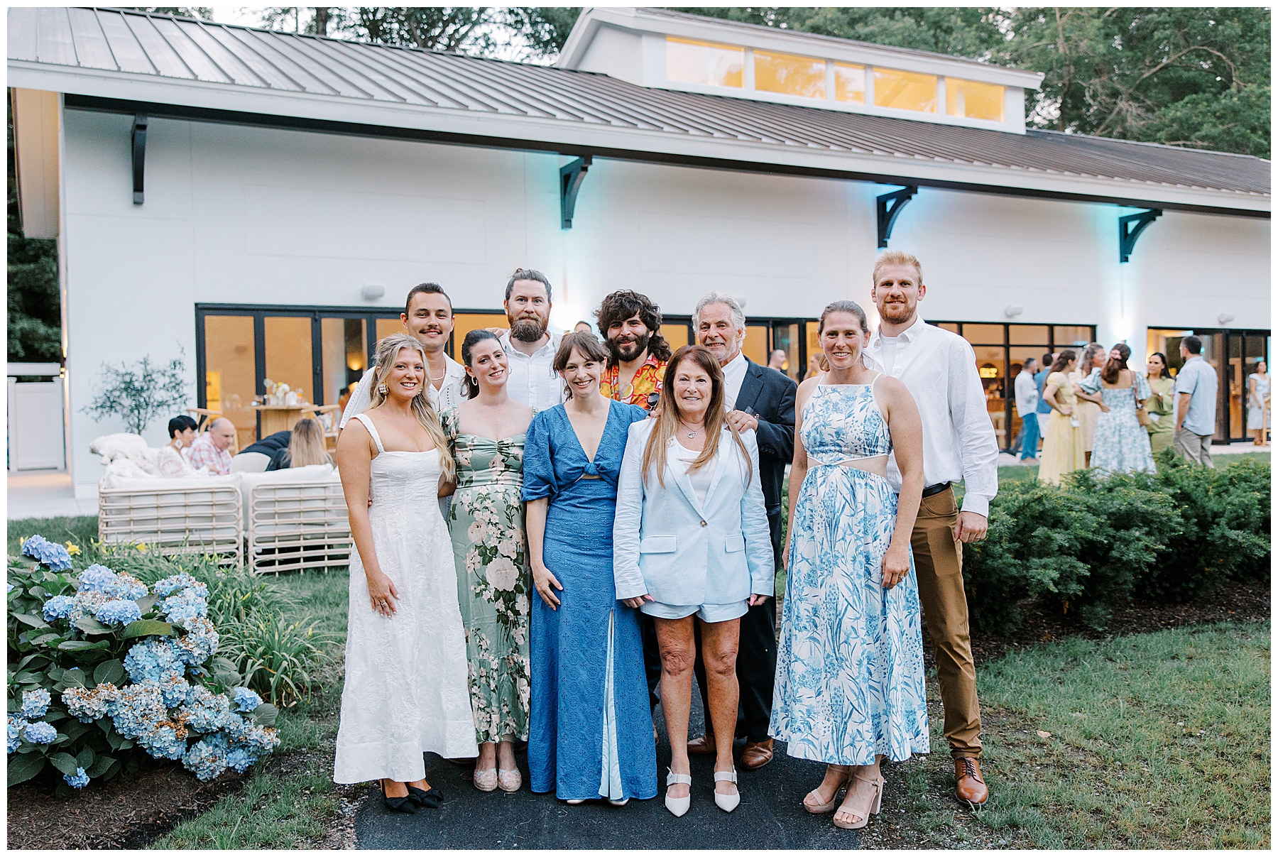 group stands outside of The Belvedere at Lake Pearl Wrentham  