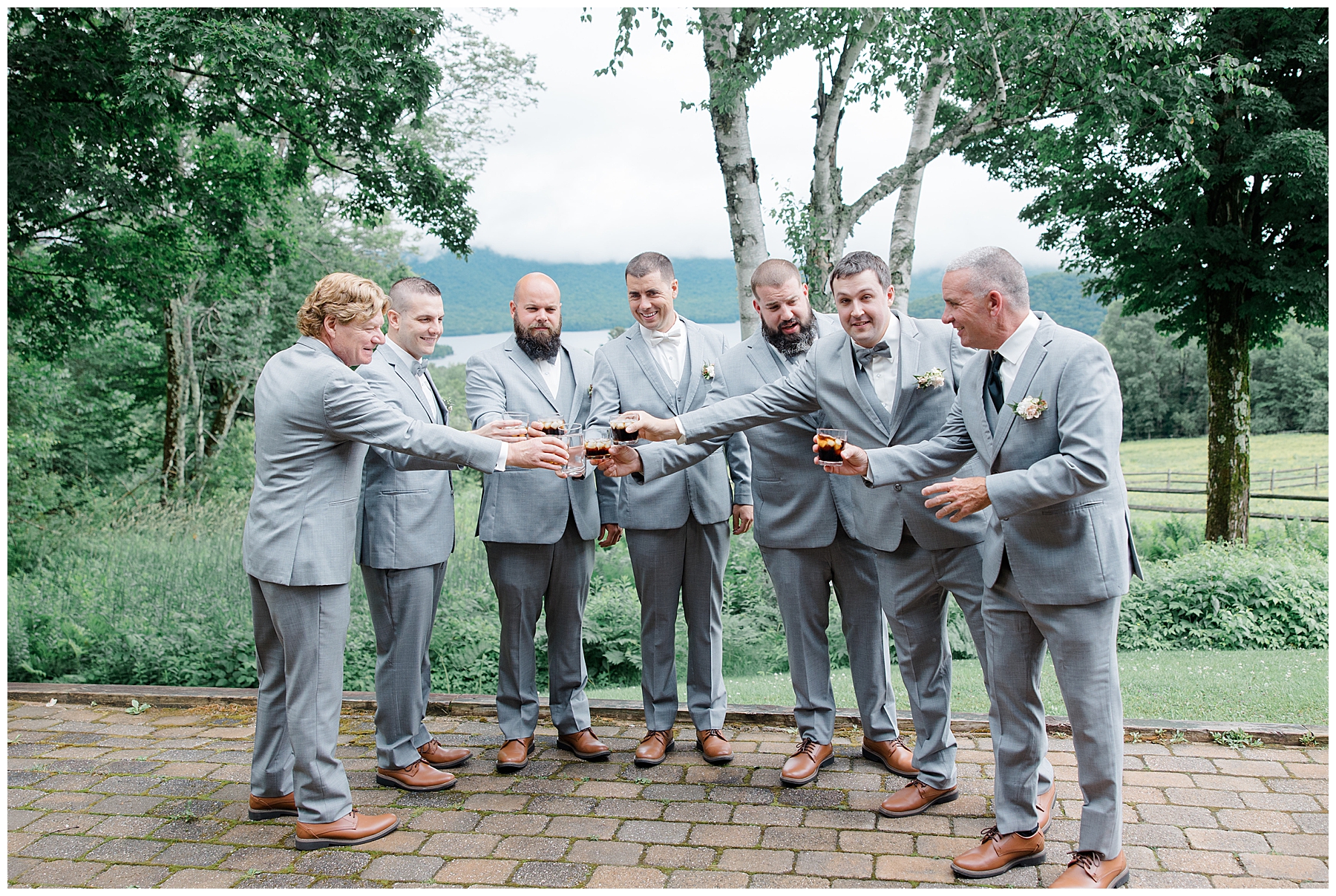 groom and groomsmen shares toast