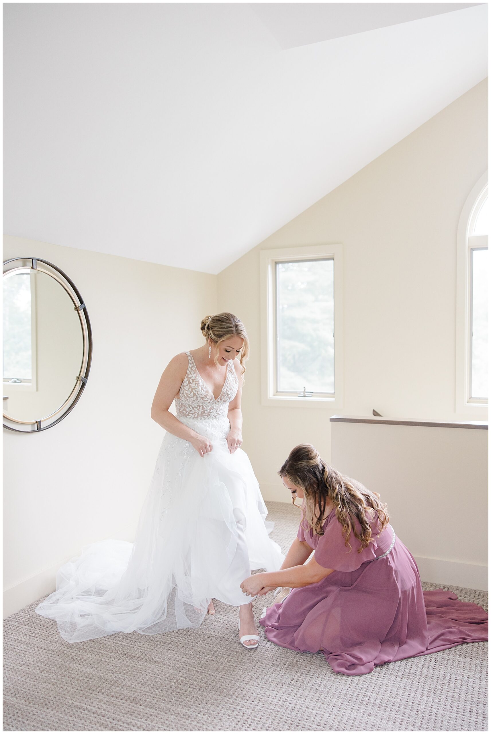 bride putting wedding shoes on