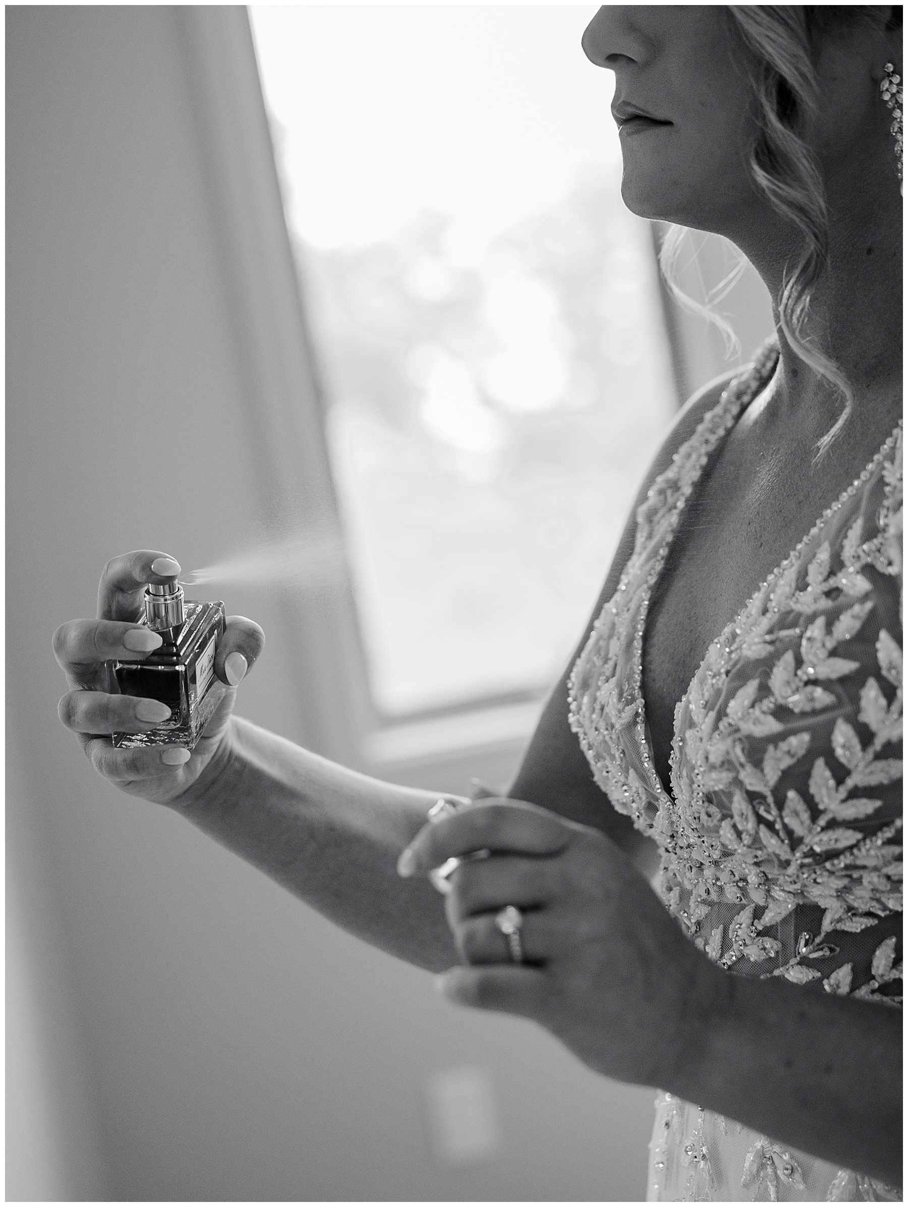 bride spraying perfume