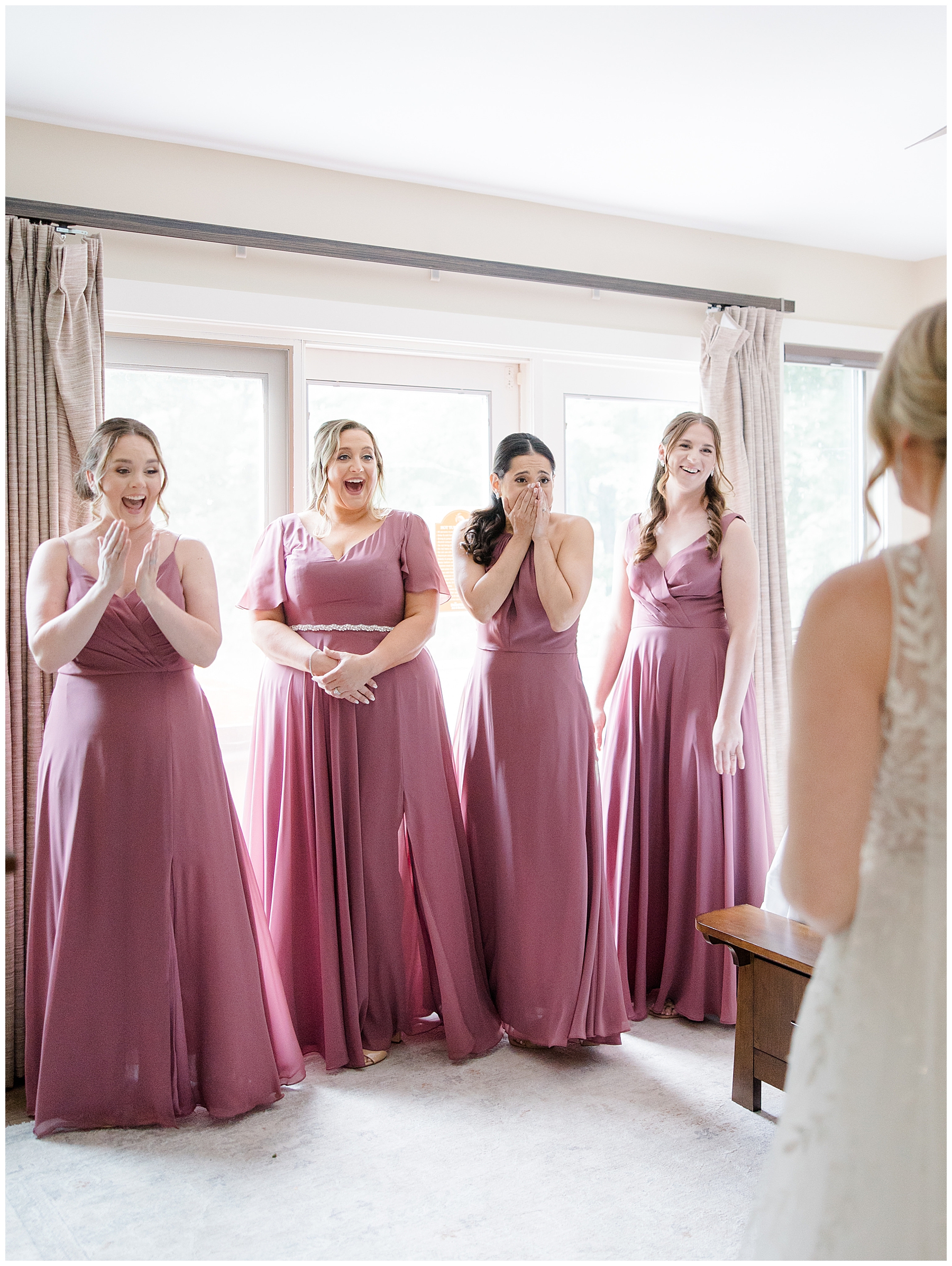 bride's first look with bridesmaids