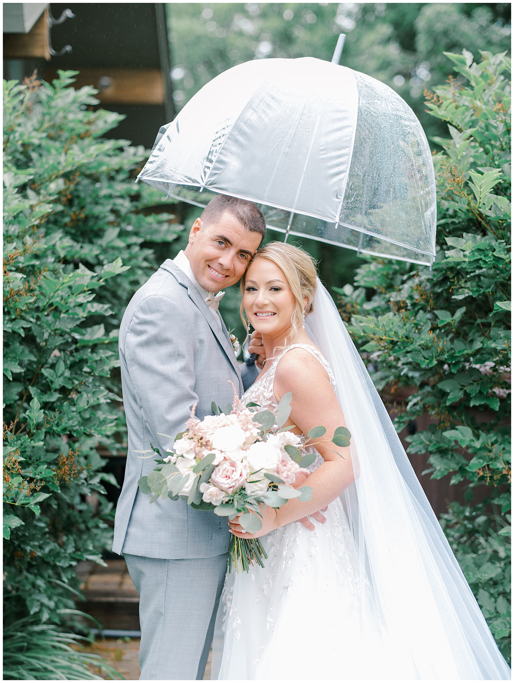 bride and groom photos with clear umbrella 