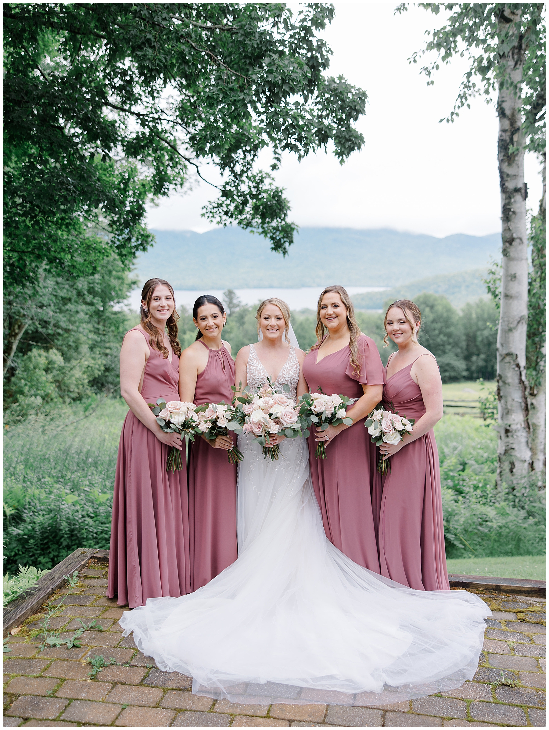 bride and bridesmaids in mauve dresses