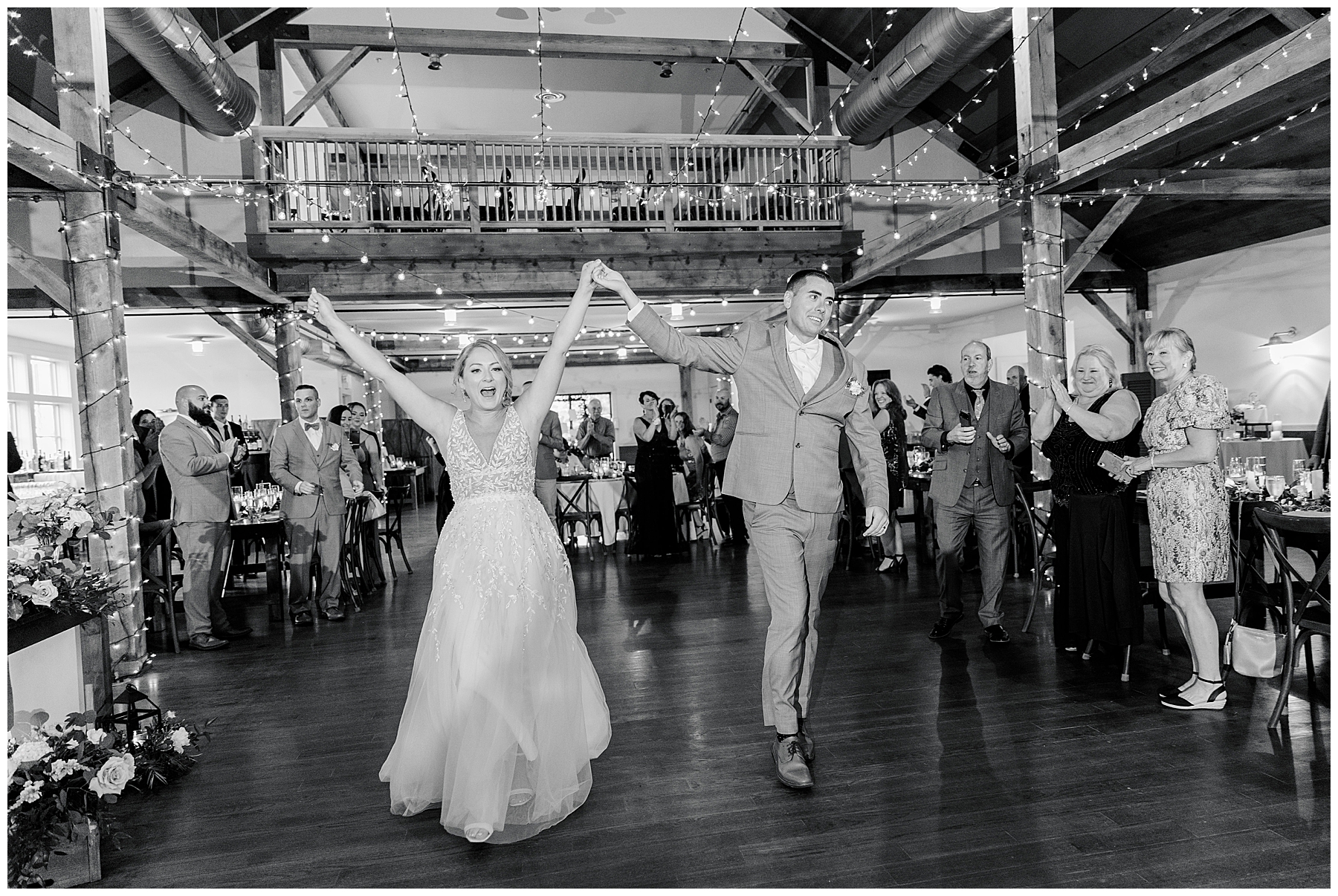 newlyweds enter wedding reception