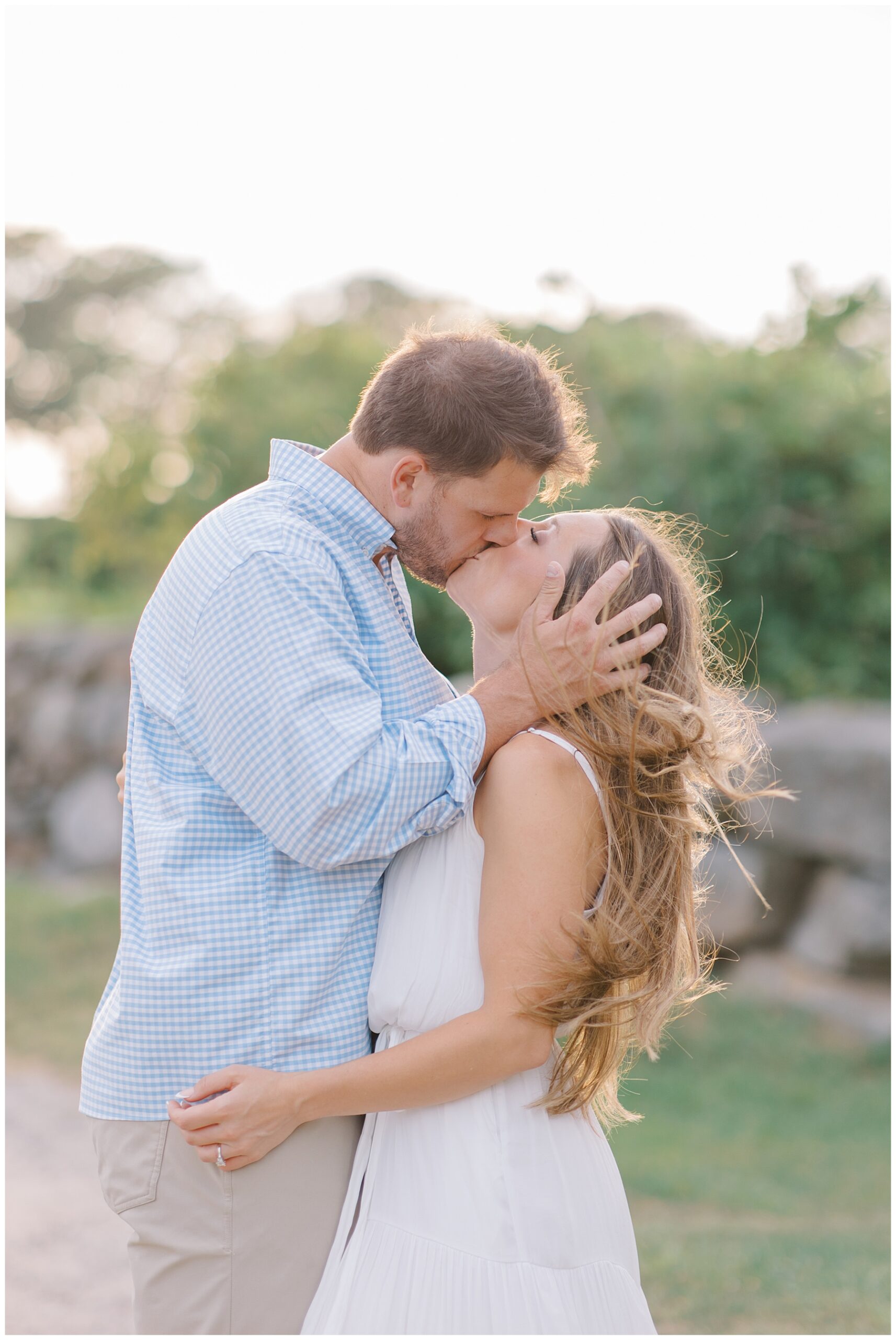 couple kiss during engagement photos