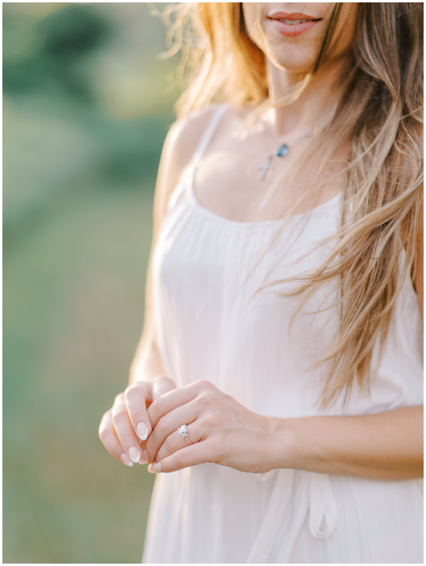 engagement ring on woman's finger