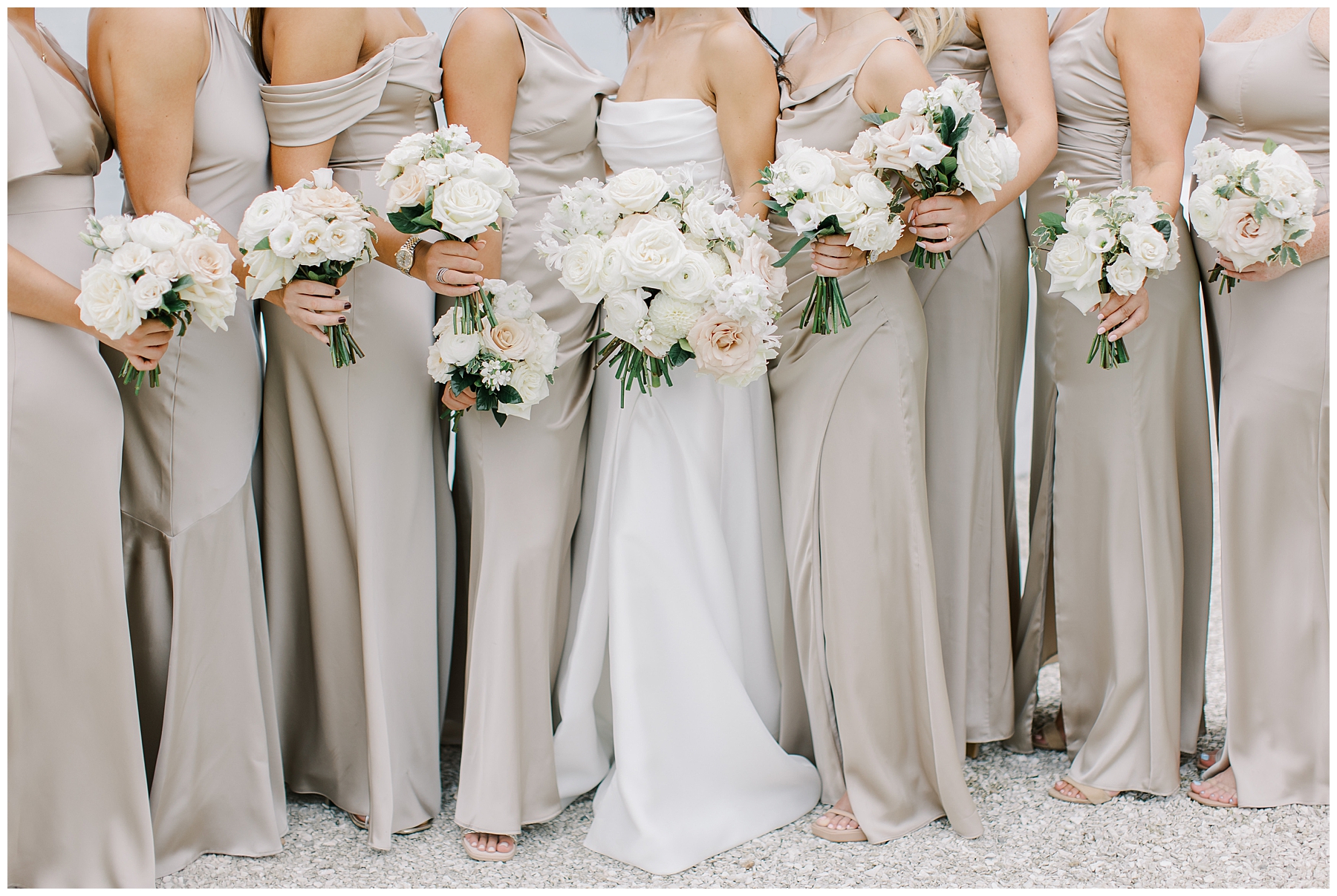 bridesmaids in champagne dresses and white bouquets