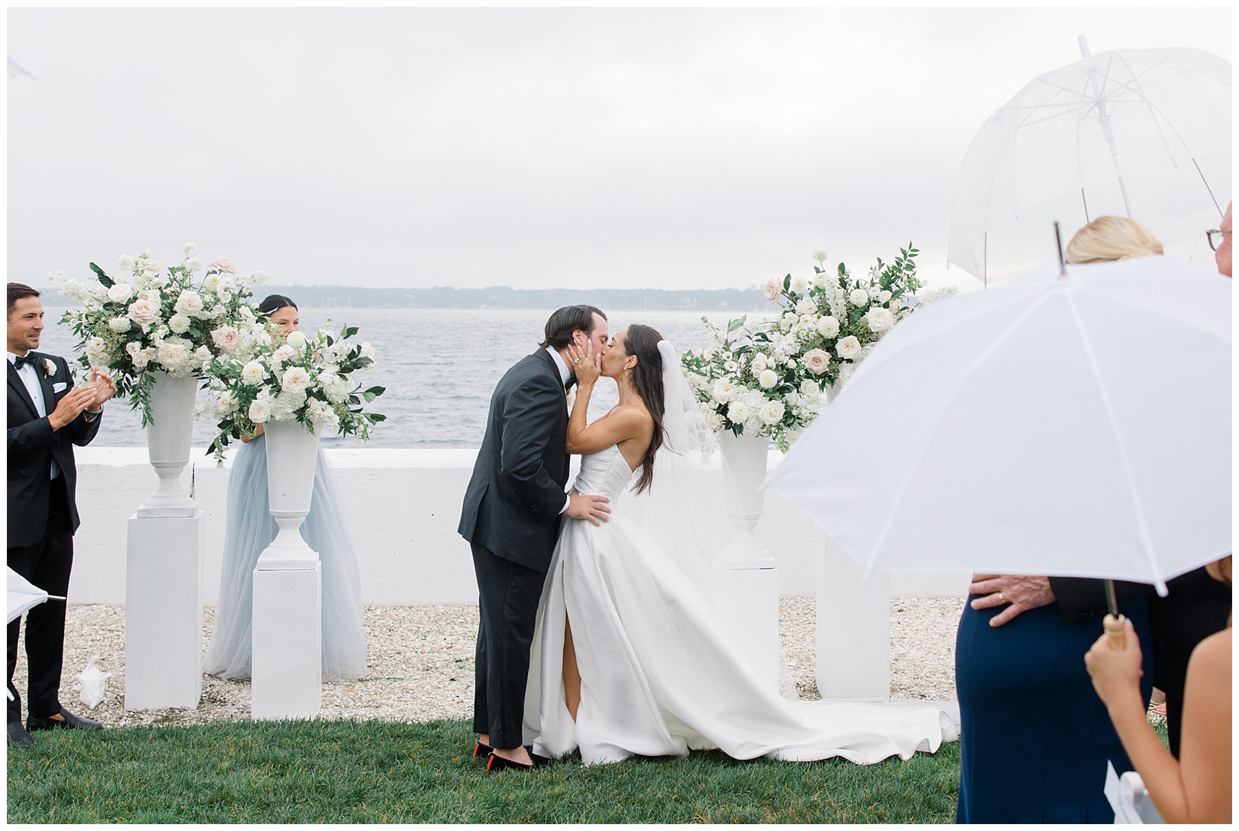 bride and groom kiss at wedding ceremony