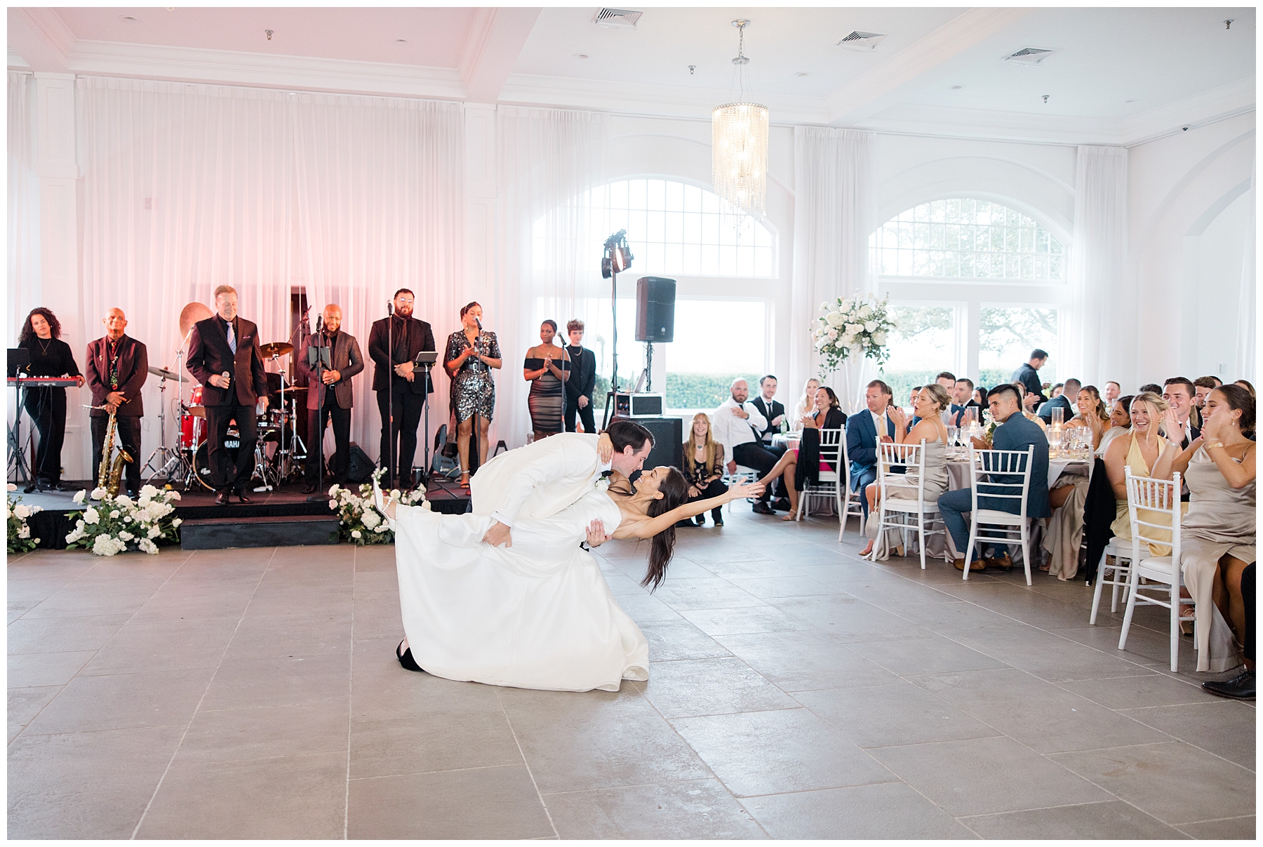 newlyweds kiss on the dance floor during first dance