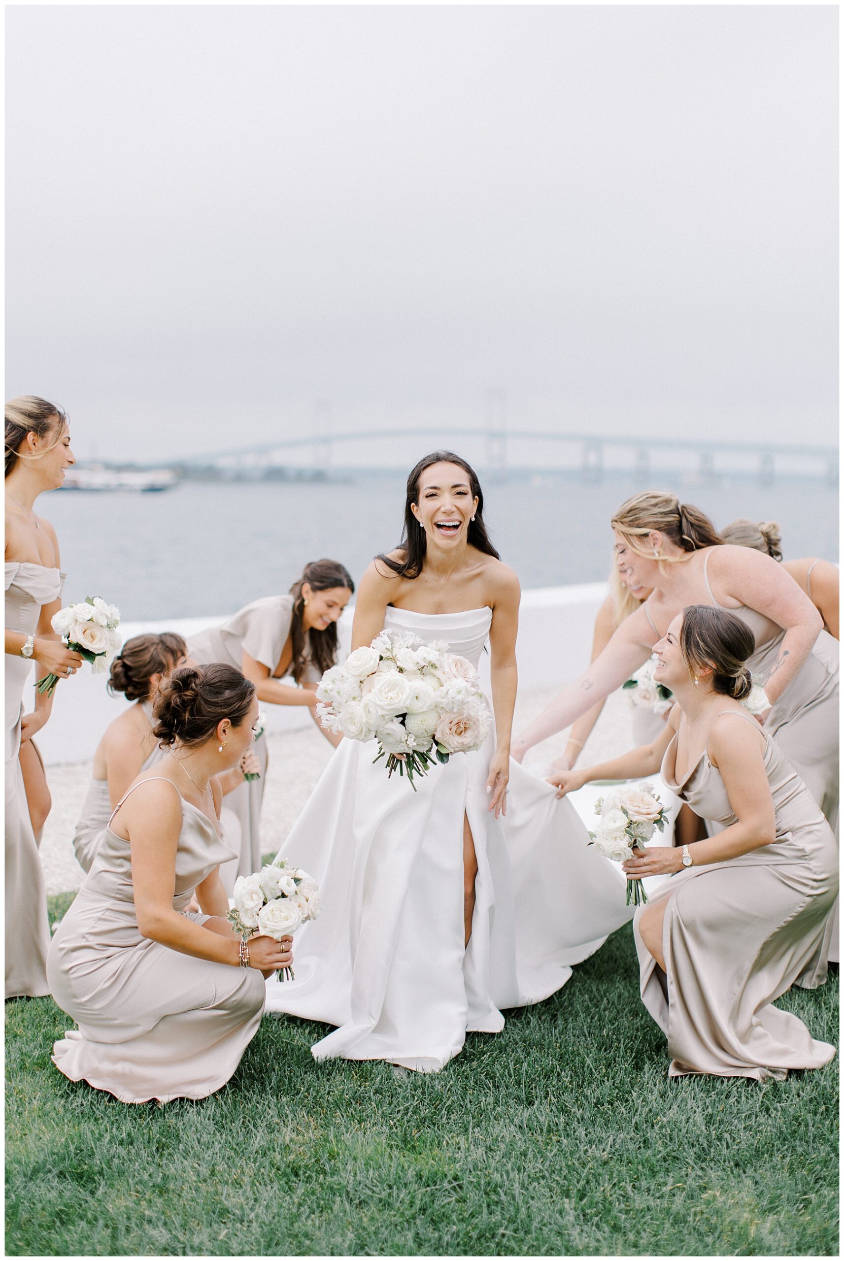 bridesmaids circle bride and help with dress