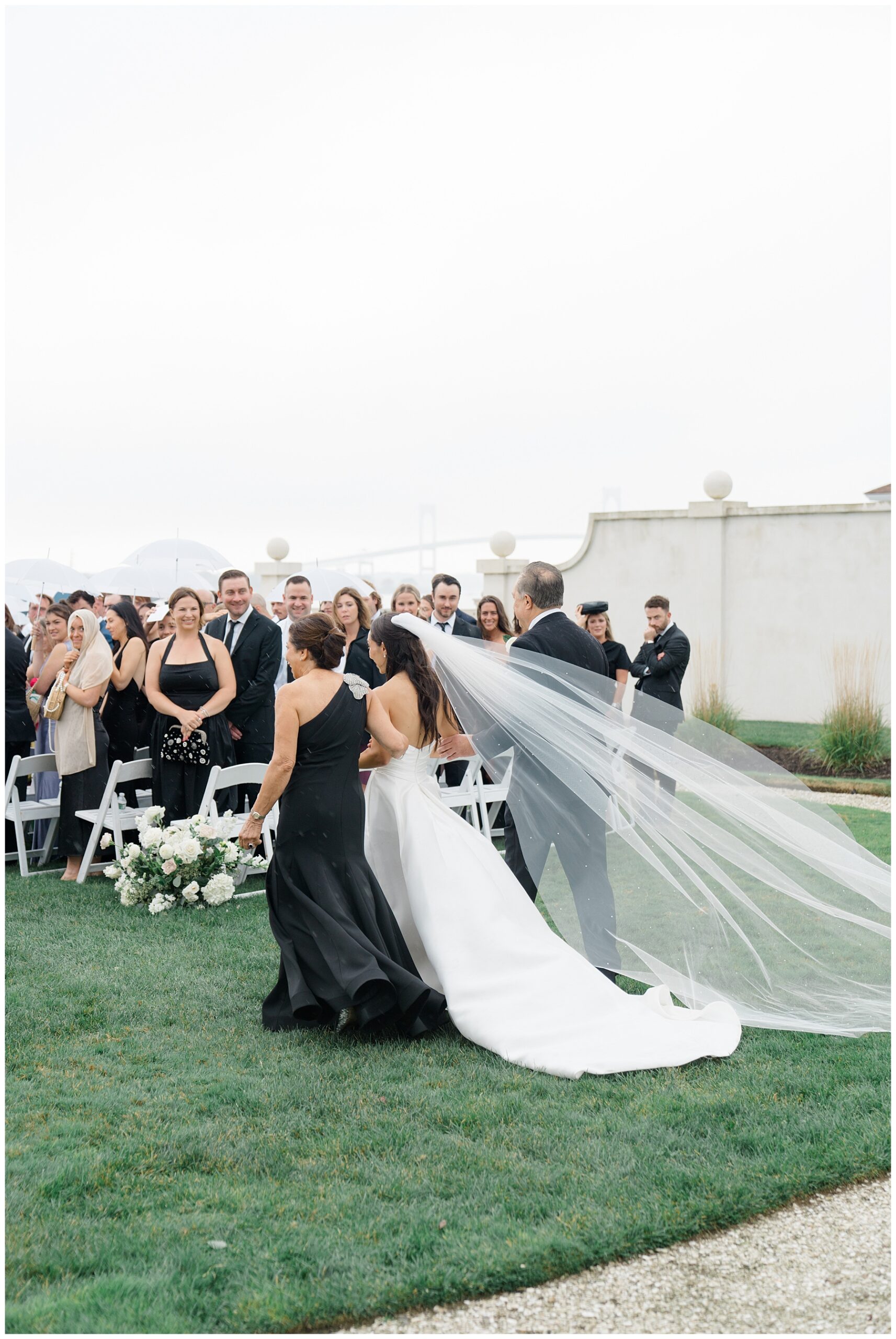 bride with parents walking down aisle