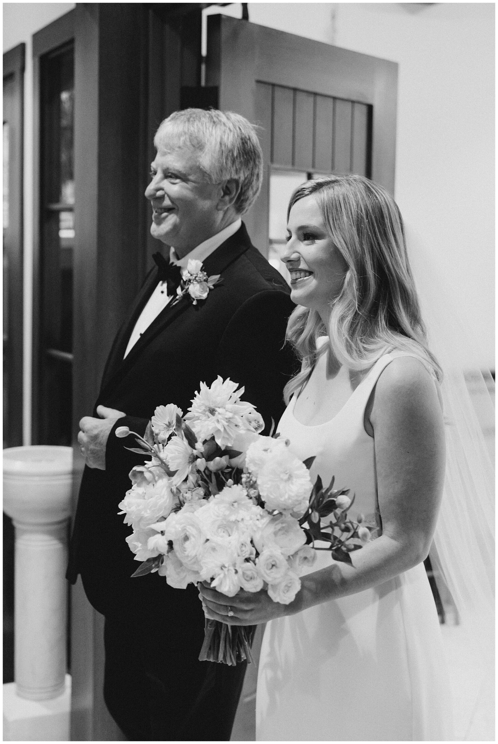 bride walks down the aisle with her father