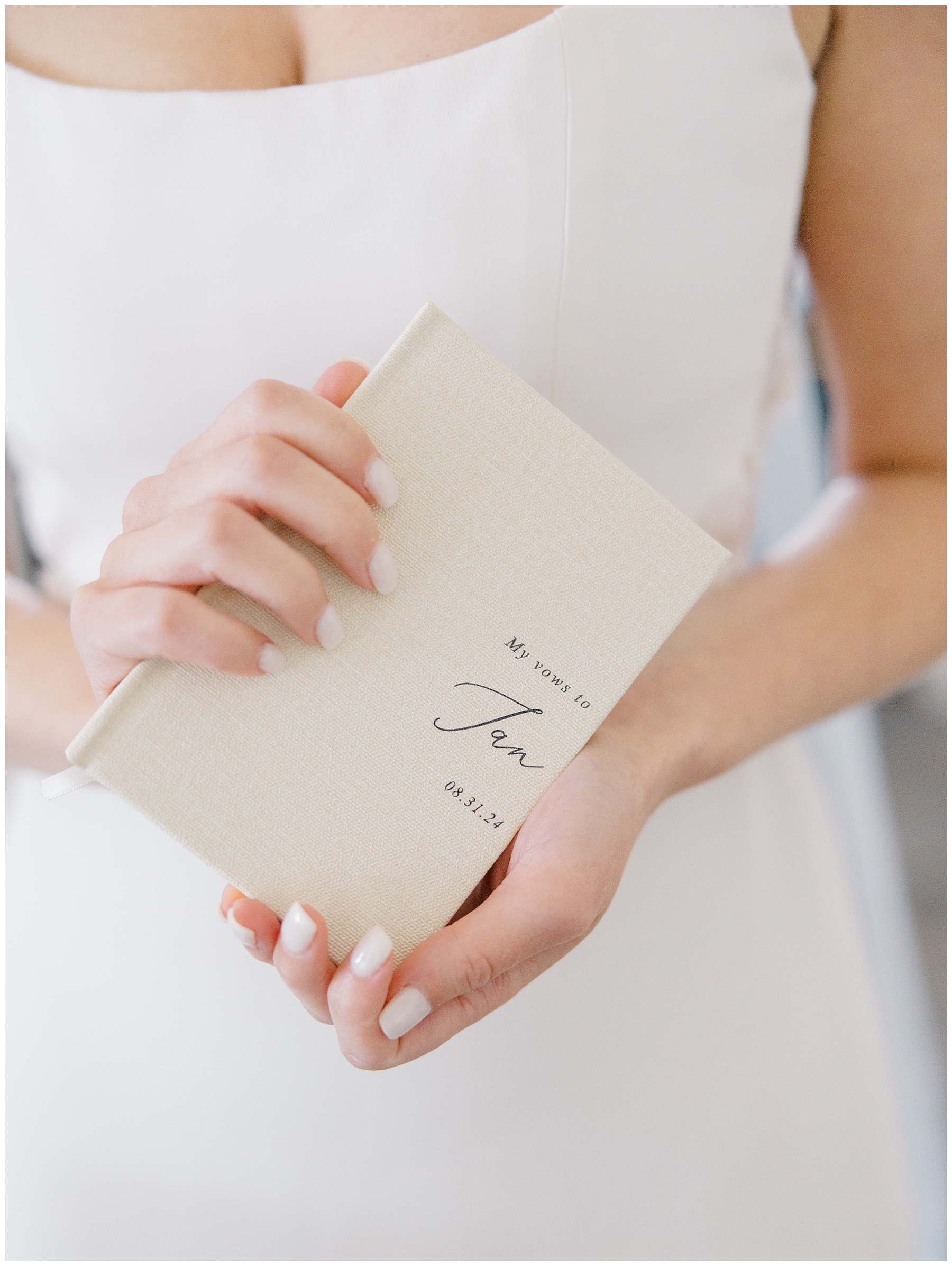 bride holding vow book