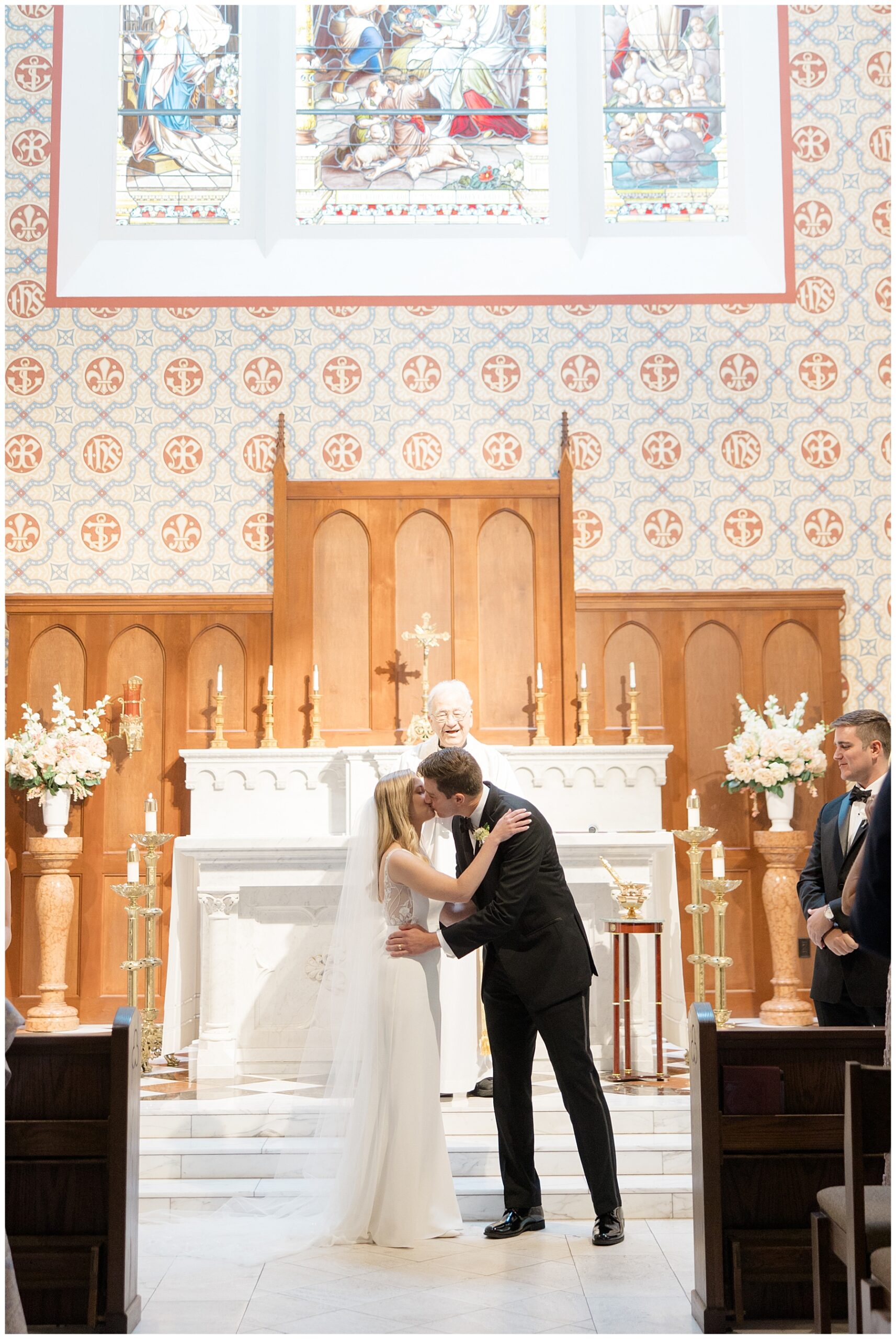 newlyweds kiss as they say I Do