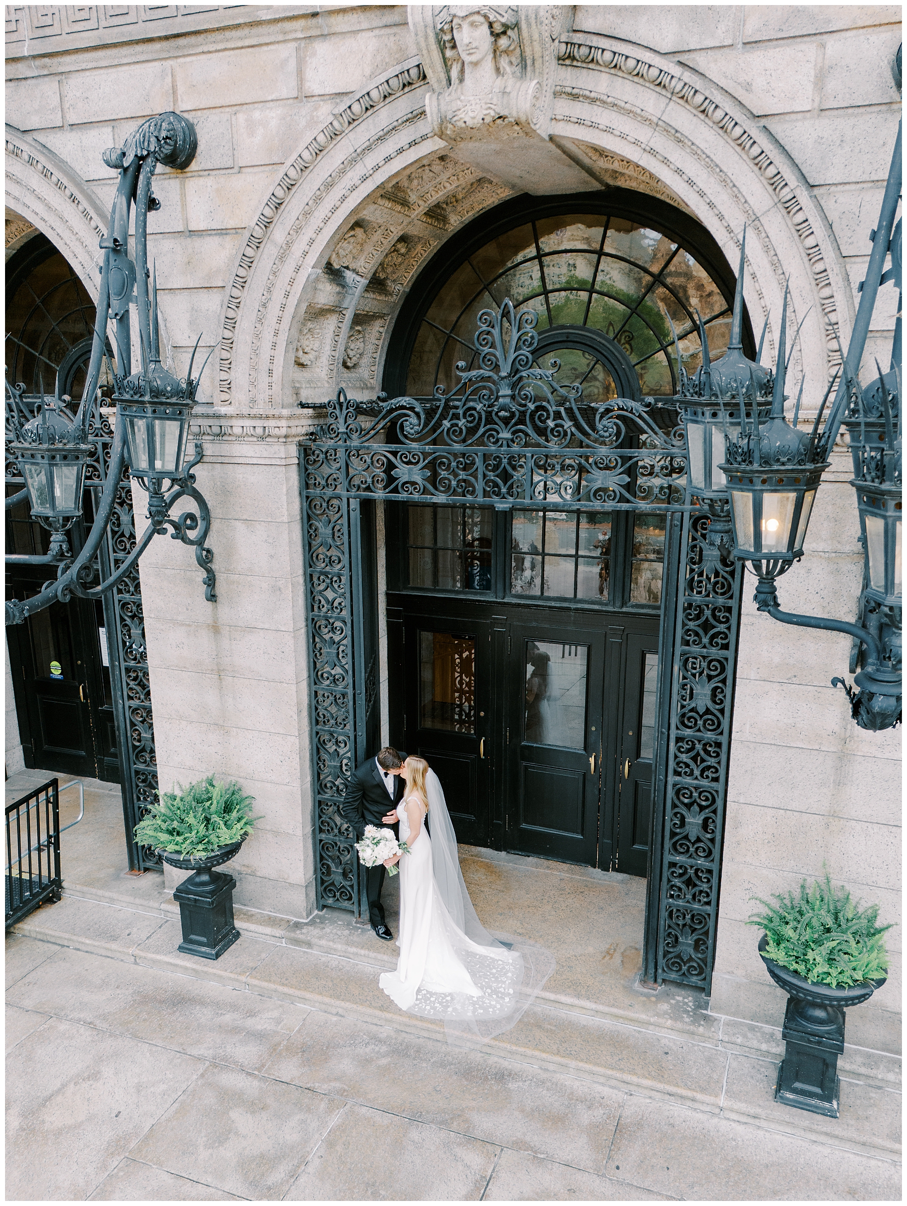 newlyweds in the archway of BPL