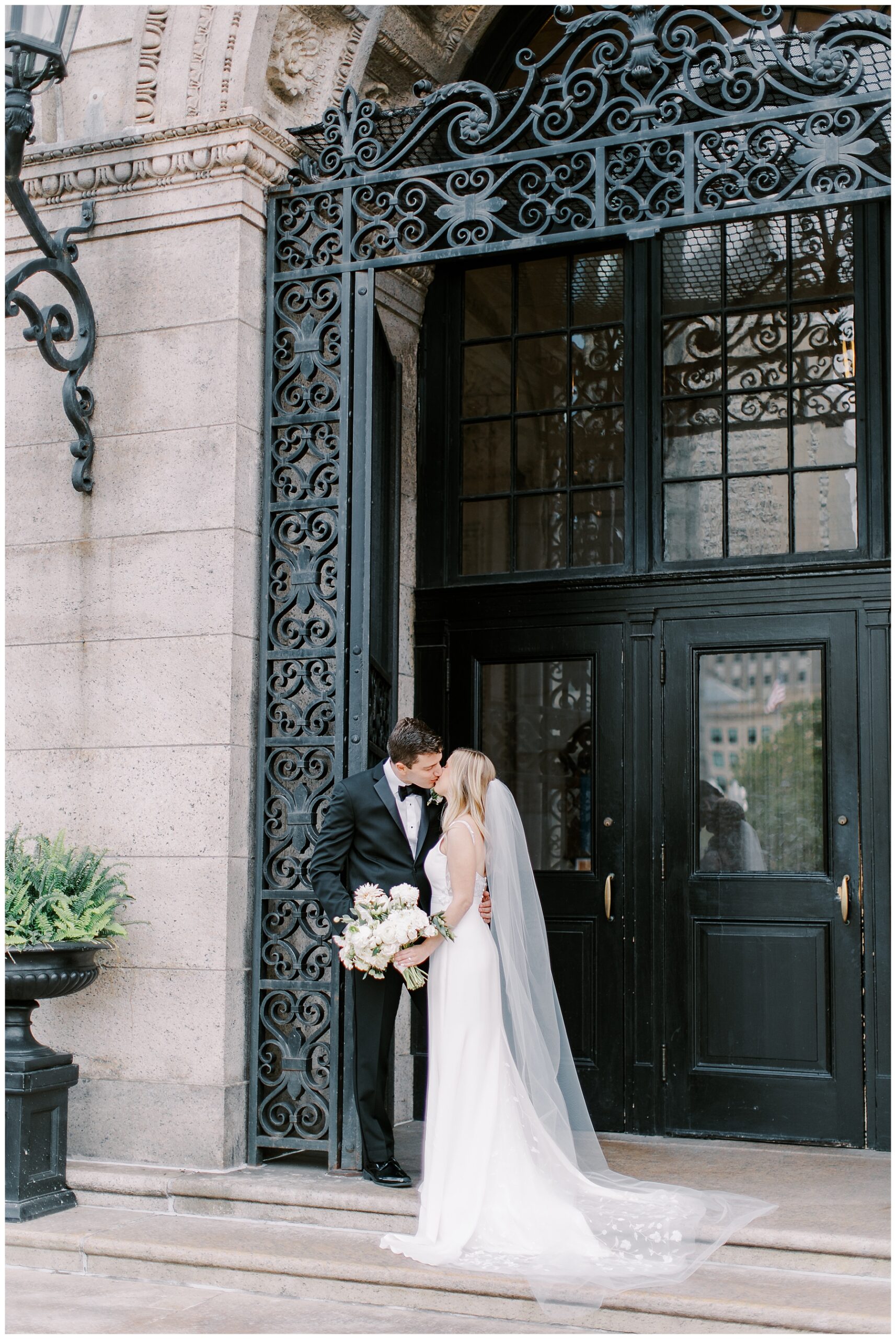 bride and groom kiss at Boston wedding
