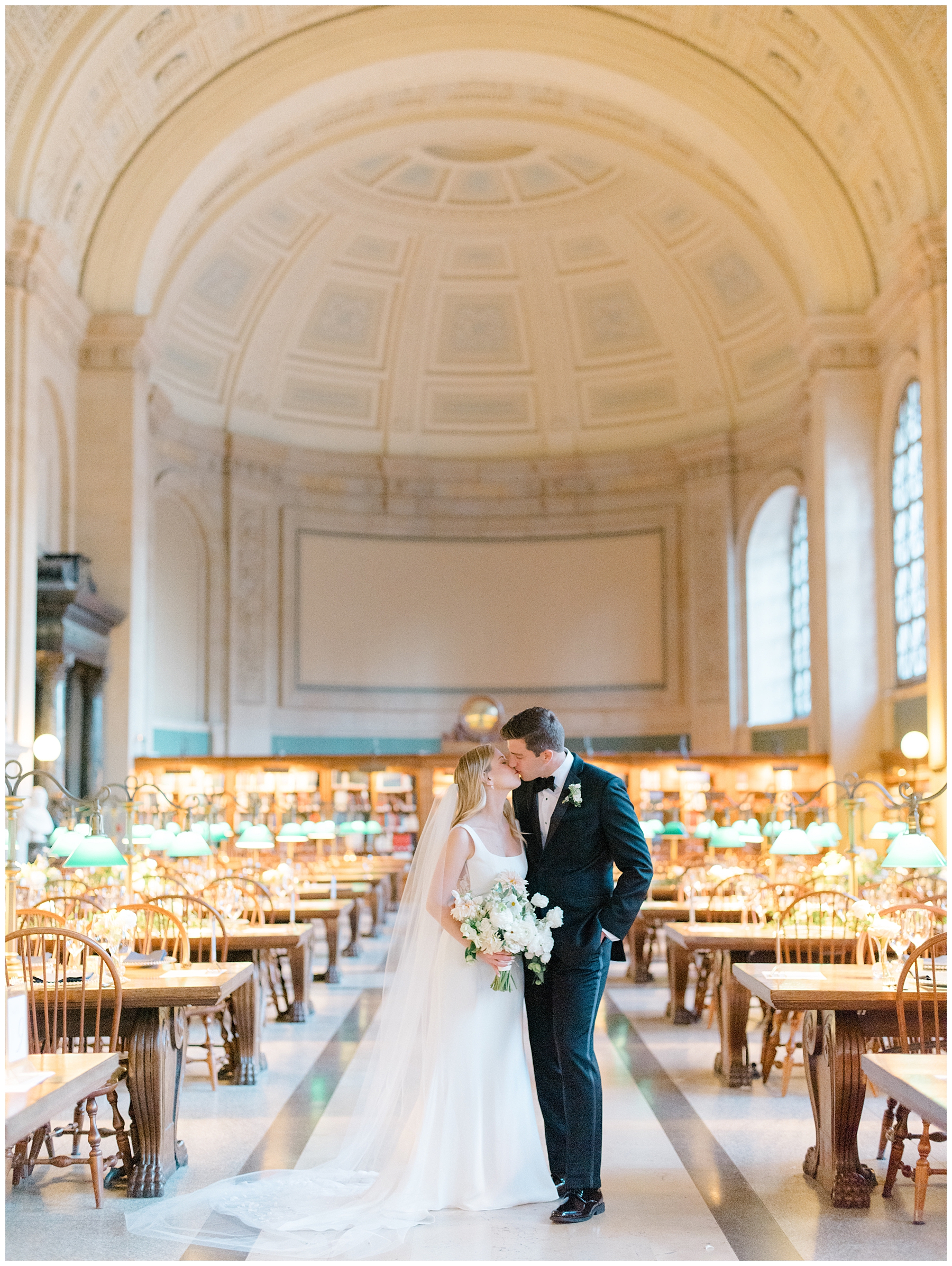 newlyweds kiss in a room of library