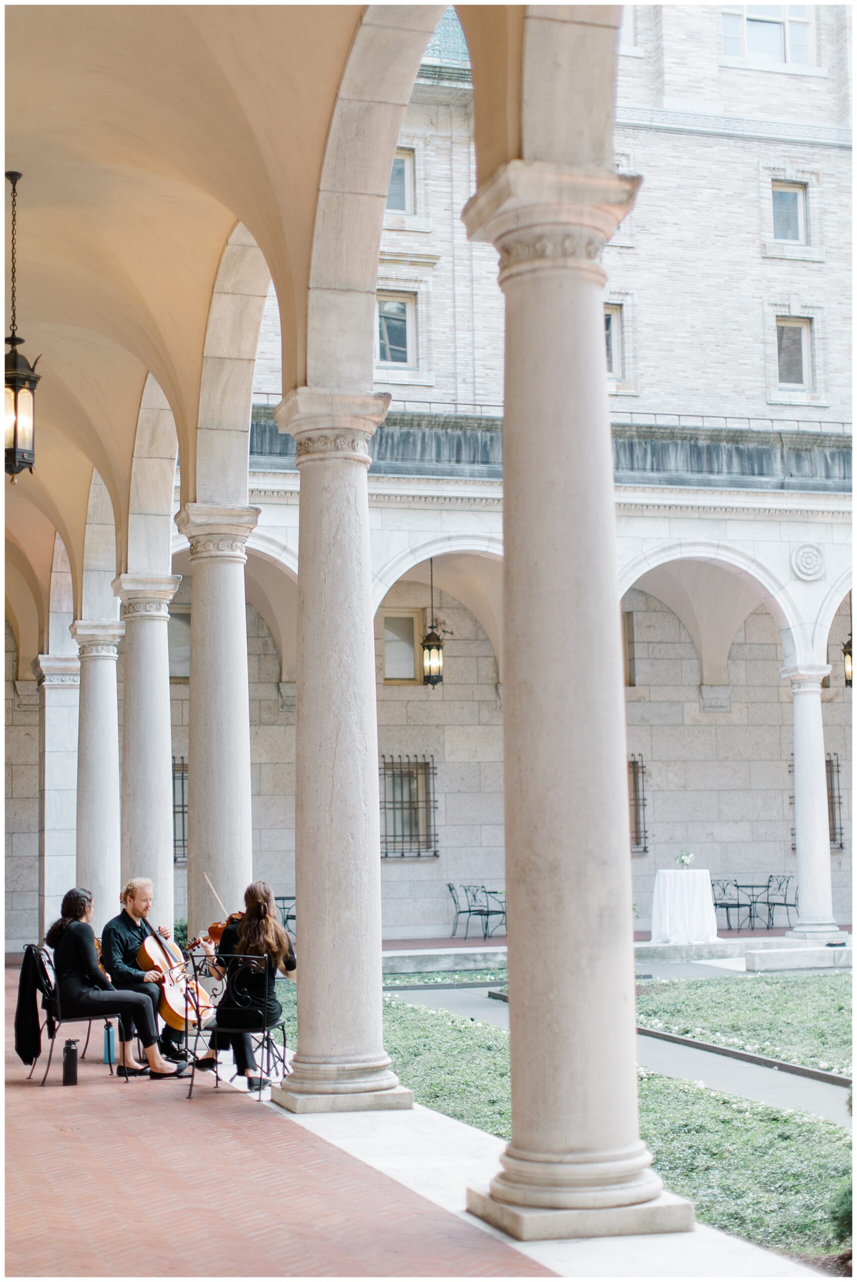 stringed instruments play in courtyard