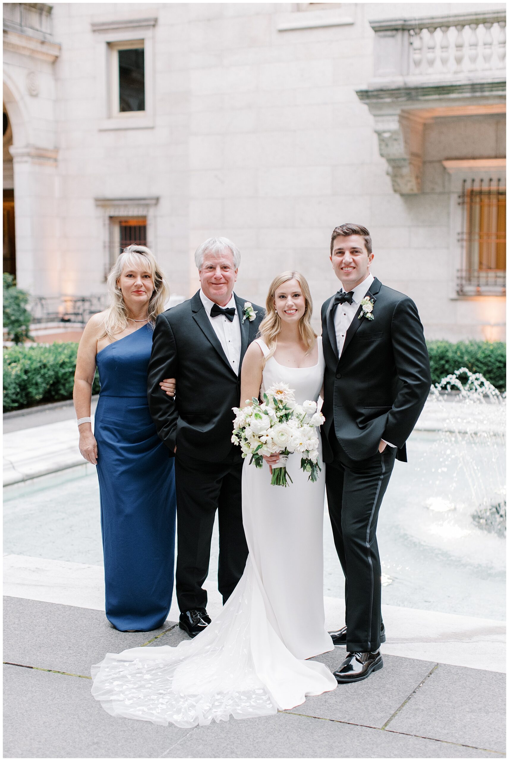 bride and groom with parents