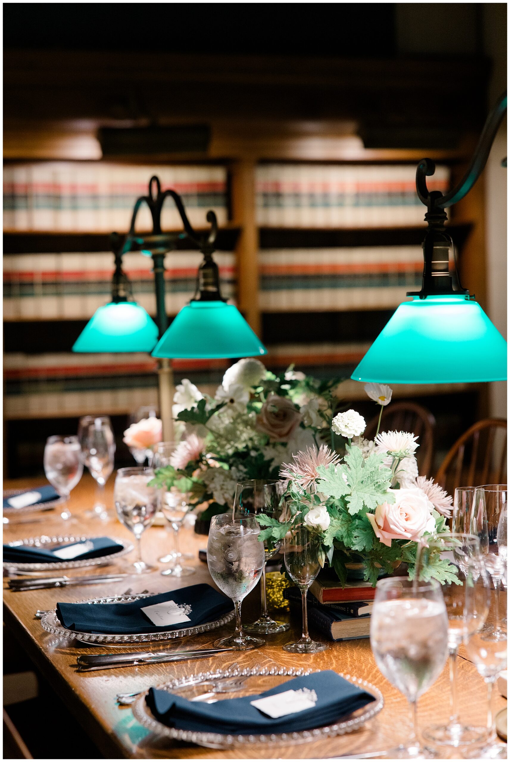 wedding flowers on stack of books at Boston Public Library wedding reception