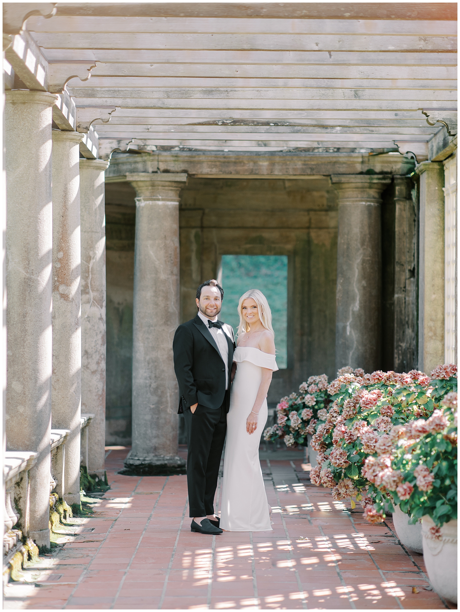 timeless engagement photos in covered walkway at Crane Estate