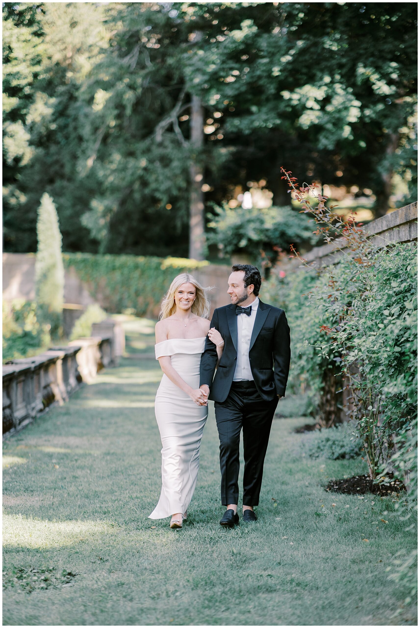 couple walk through the gardens at Crane Estate