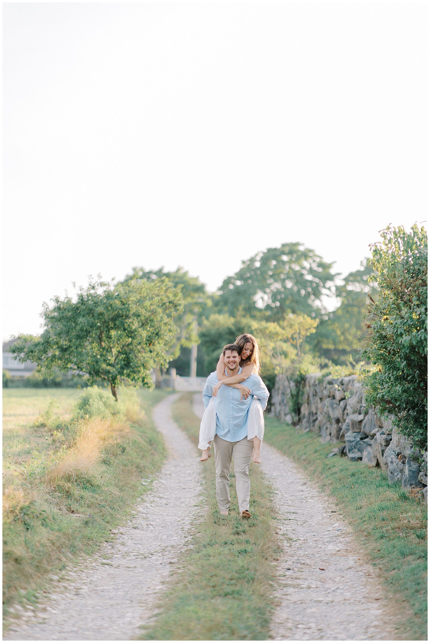 guy carries fiance on his back