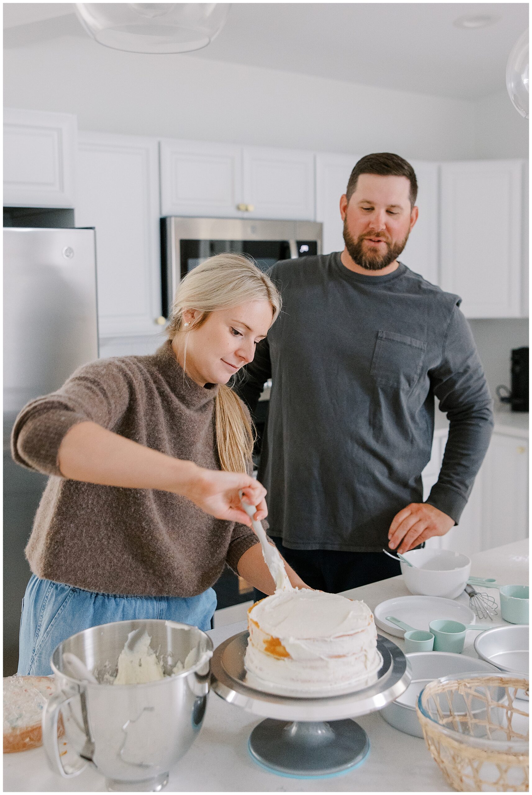 unique engagement session at-home baking a wedding cake
