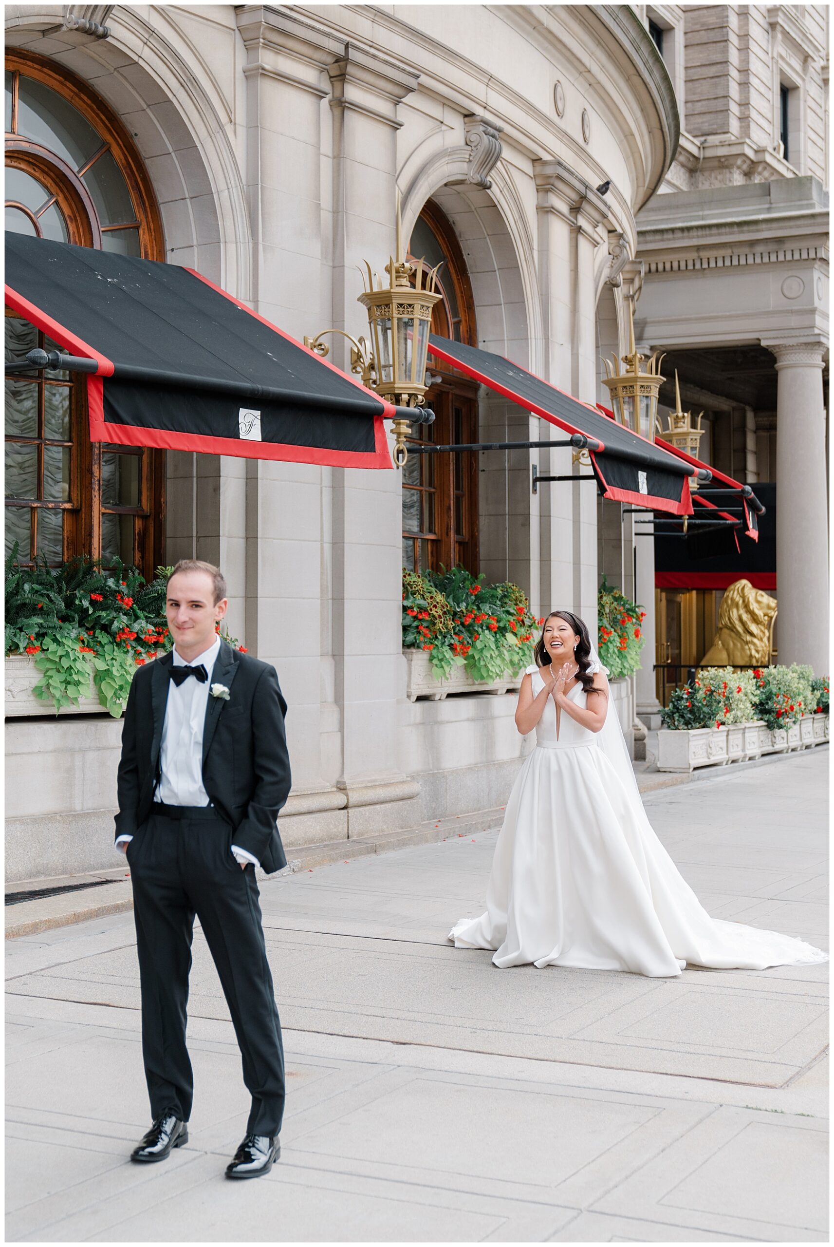 joyful first look photo outside of Fairmont Copley Plaza Hotel