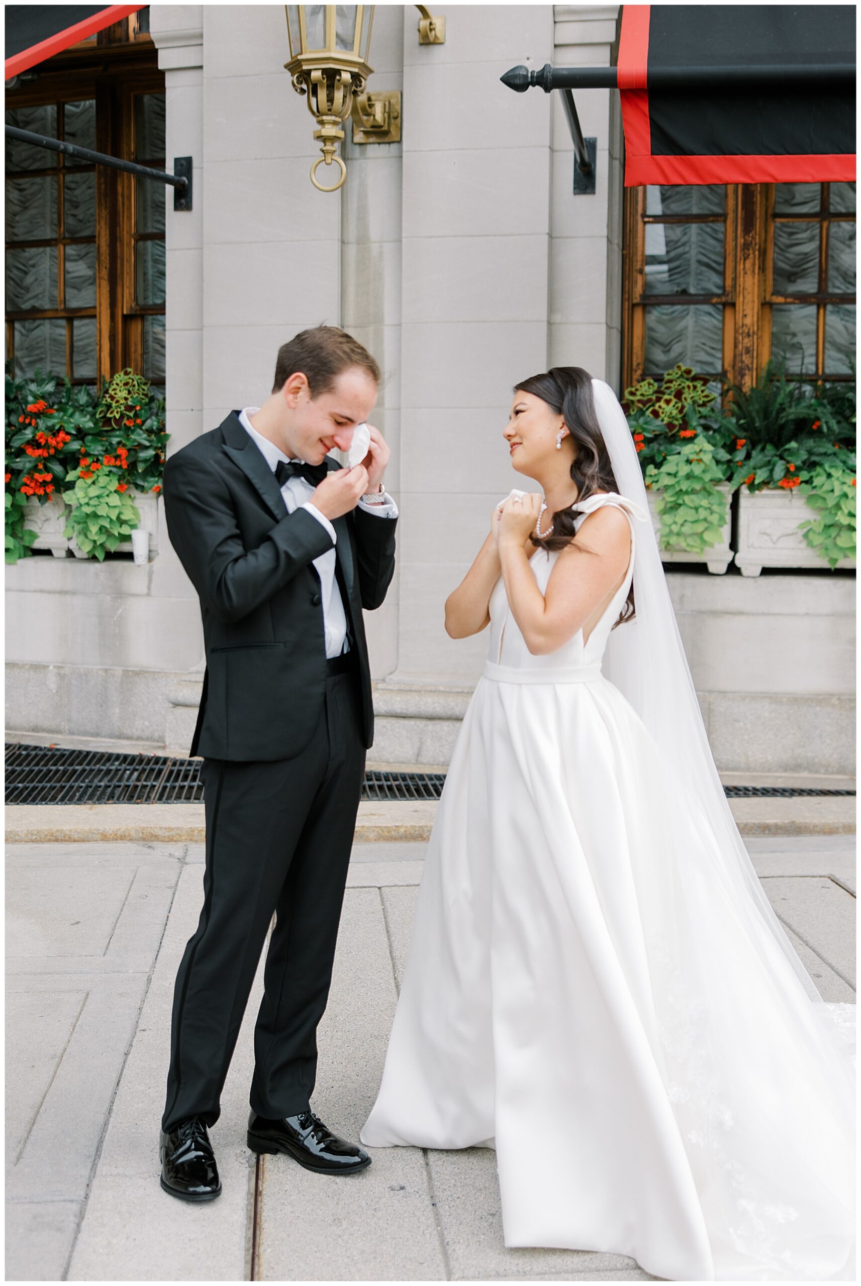 Emotional groom wipes away tears after seeing bride for the first time