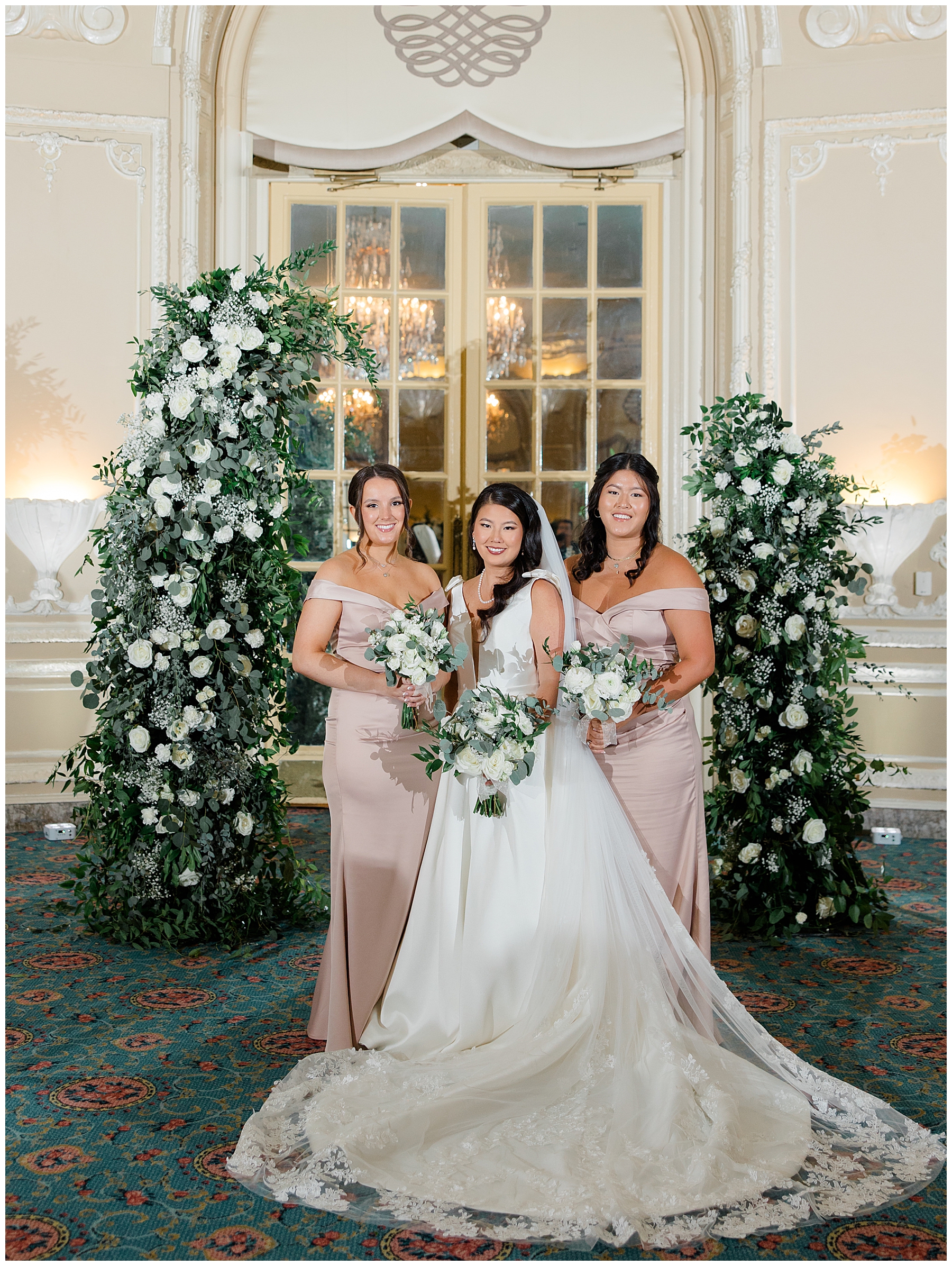 bride with bridesmaids in pink dresses
