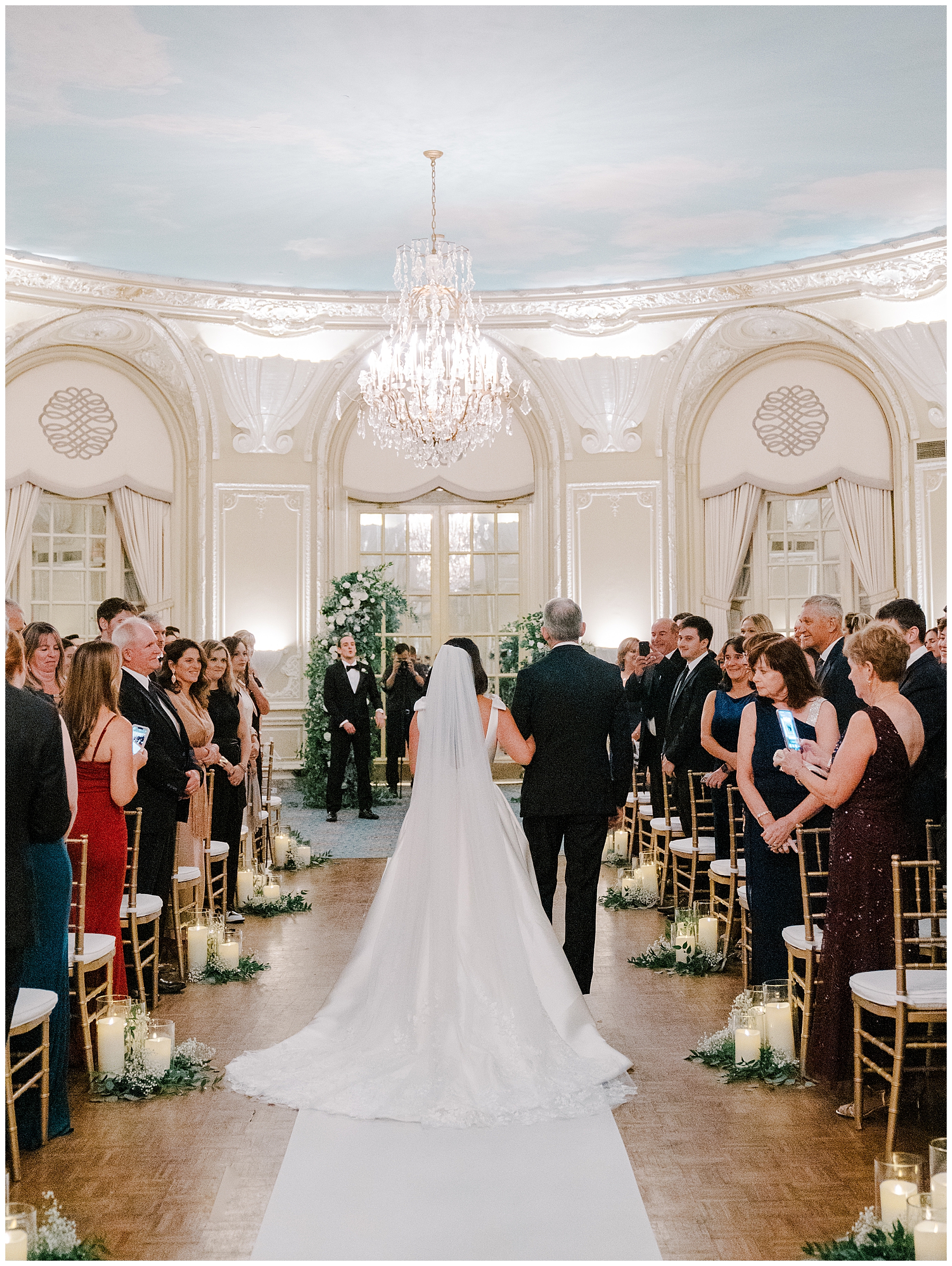 Bride walks down aisle to wedding reception